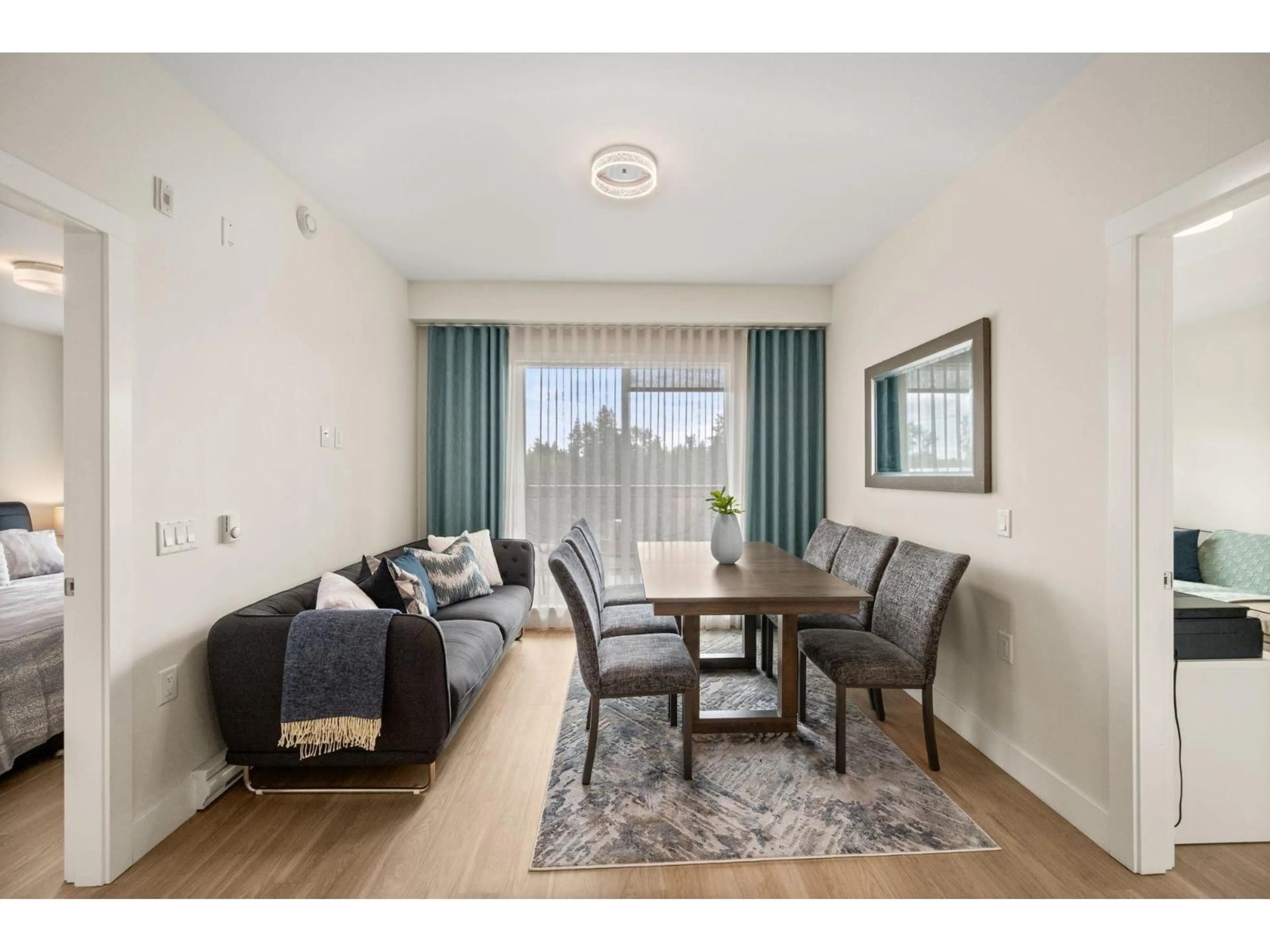 Living room with furniture, wood/laminate floor for 603 - 6960 NICHOLSON, Delta British Columbia V4E0A9