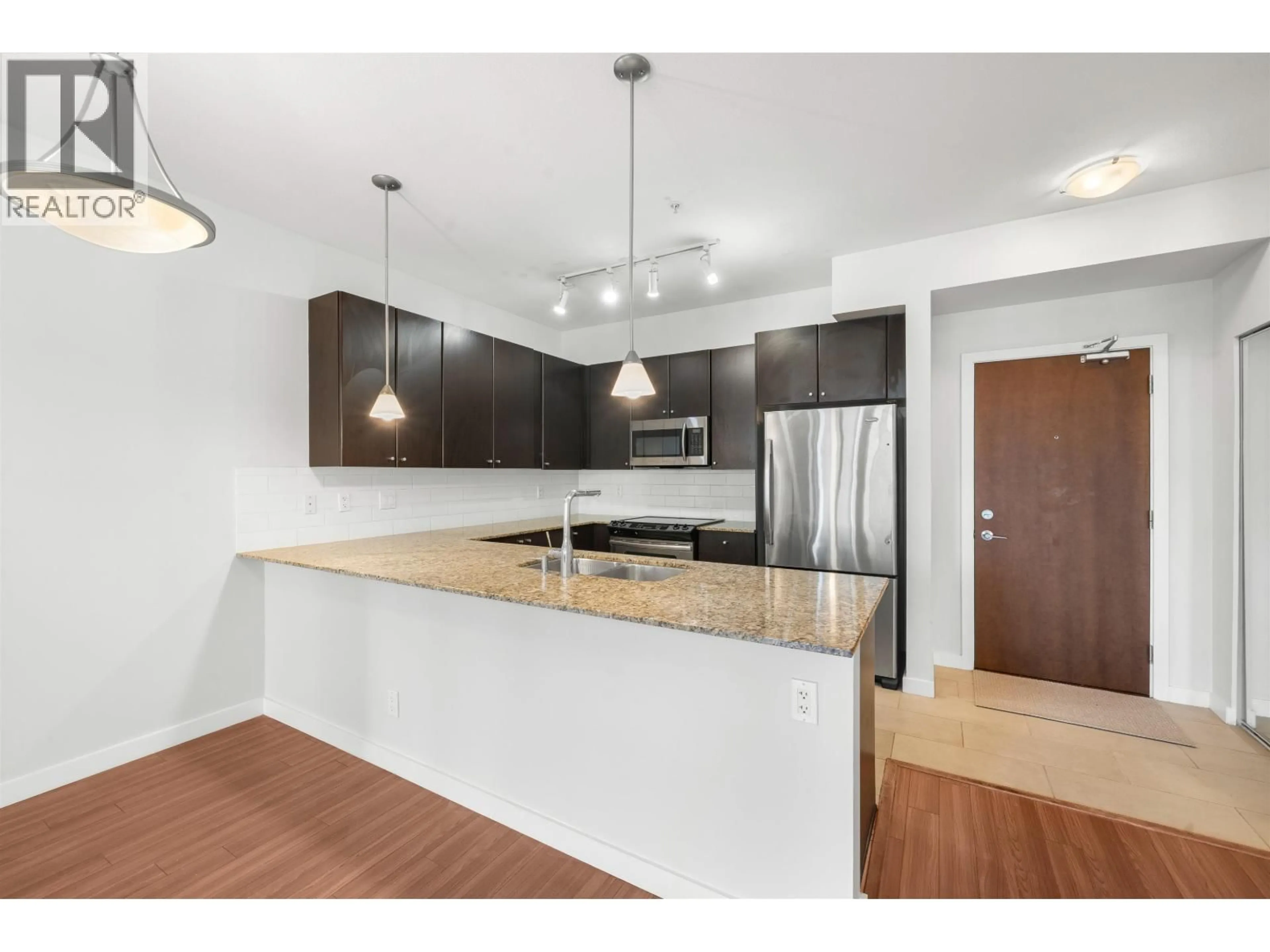 Open concept kitchen, wood/laminate floor for 317 - 225 FRANCIS WAY, New Westminster British Columbia V3L0G1