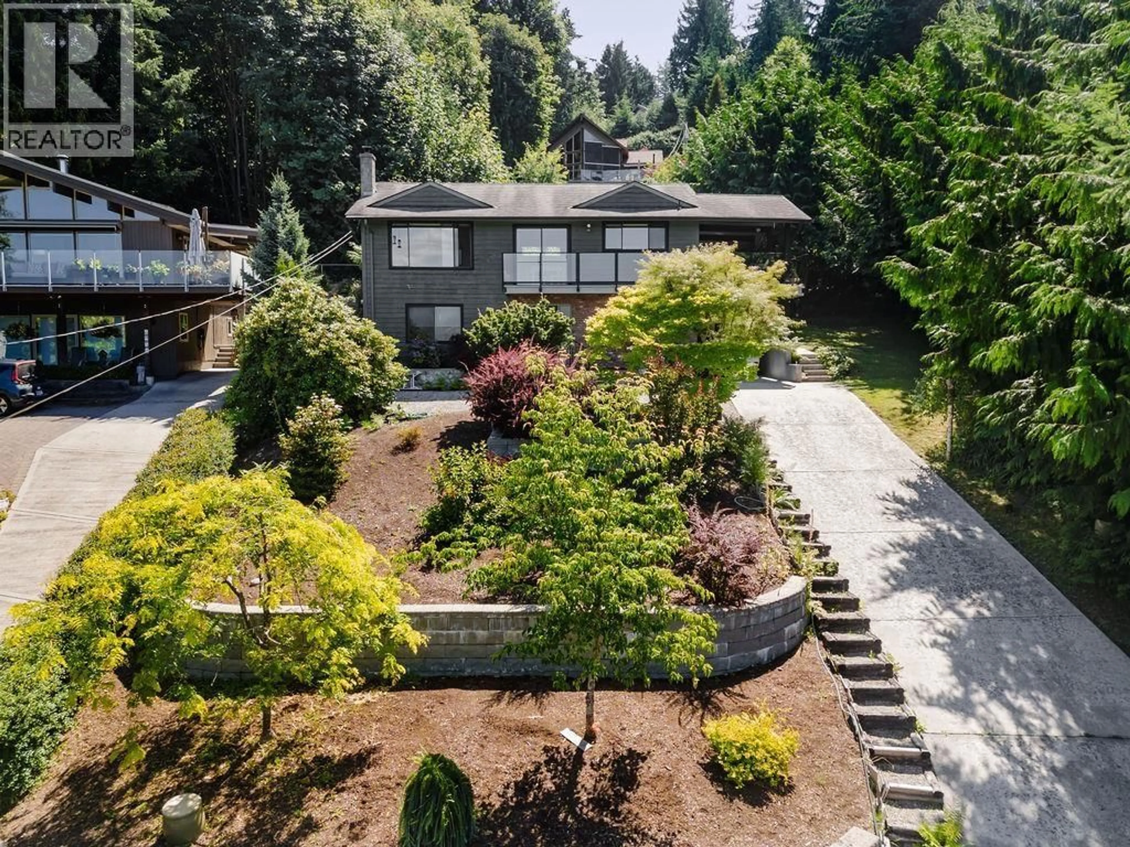 A pic from outside/outdoor area/front of a property/back of a property/a pic from drone, street for 6950 PORPOISE DRIVE, Sechelt British Columbia V7Z0C8