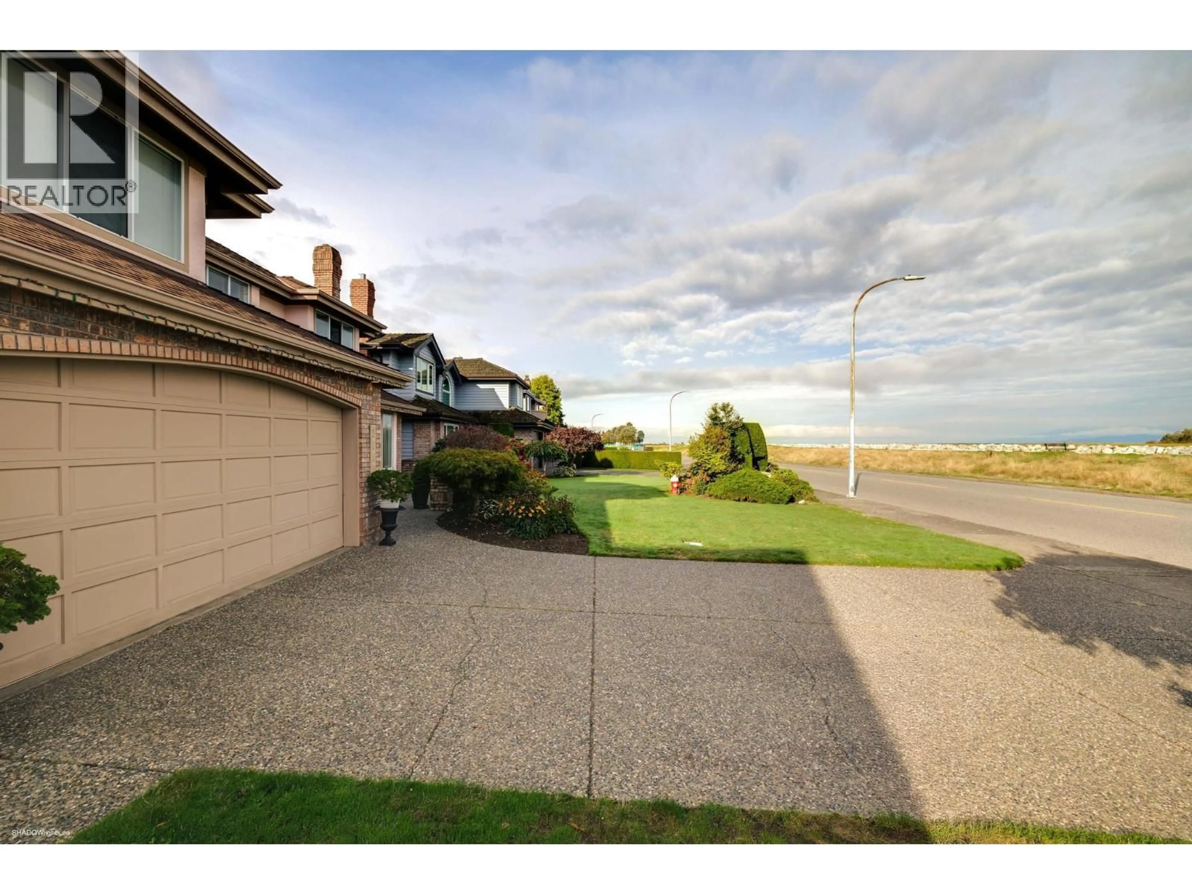 A pic from outside/outdoor area/front of a property/back of a property/a pic from drone, water/lake/river/ocean view for 3600 RIVER ROAD, Richmond British Columbia V7C5M5