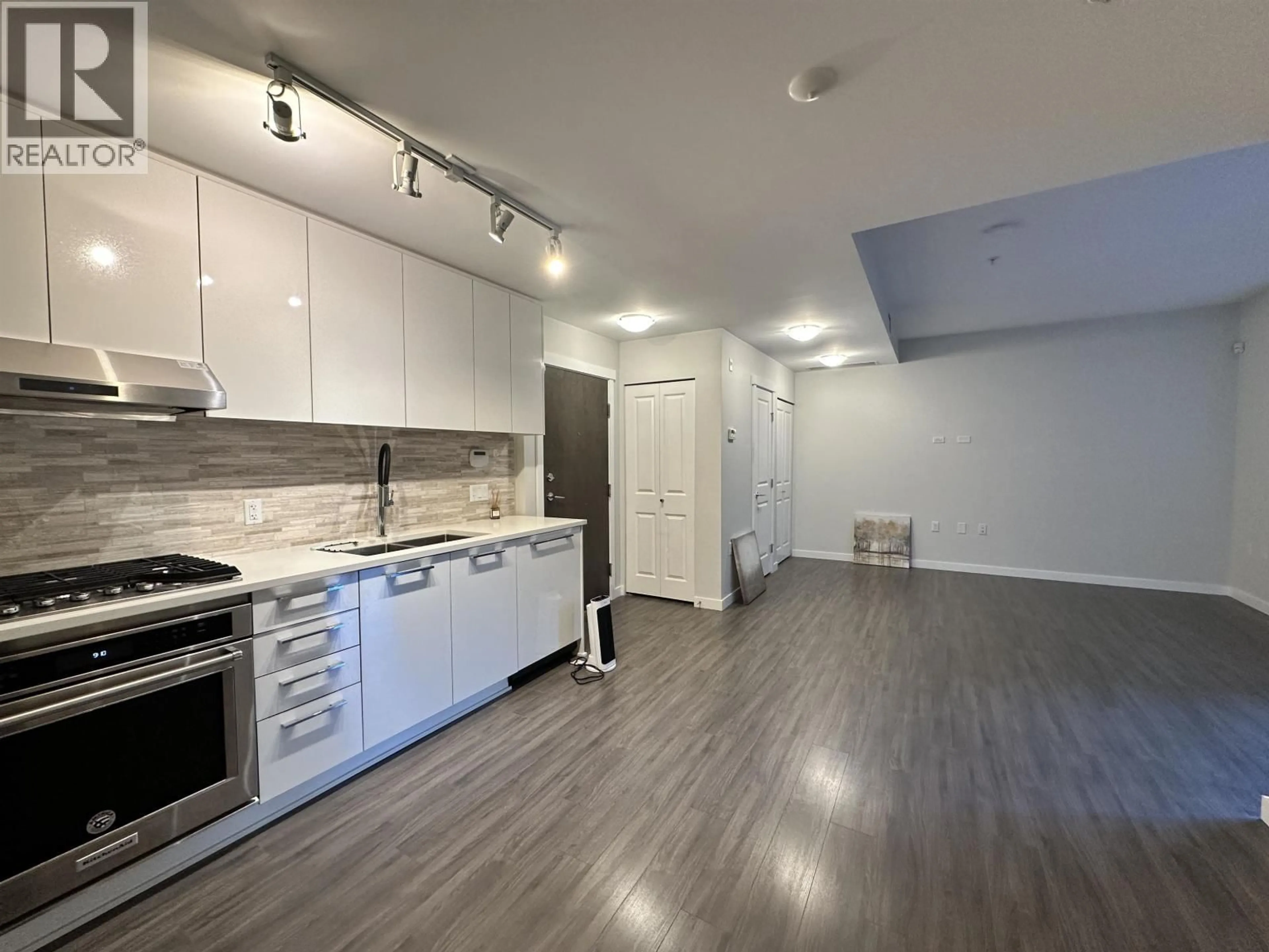 Open concept kitchen, wood/laminate floor for 122 - 9500 TOMICKI AVENUE, Vancouver British Columbia V6X0R9
