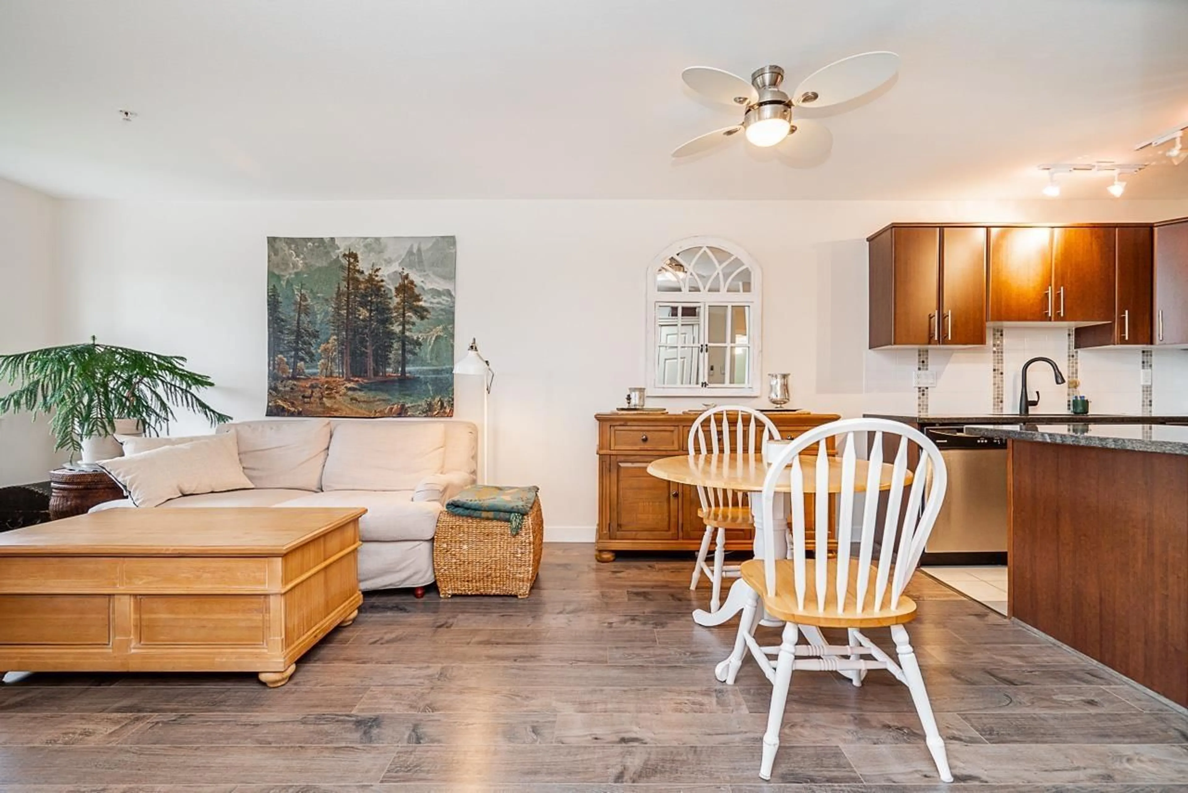 Living room with furniture, wood/laminate floor for 309 - 19388 65, Surrey British Columbia V4N5S1