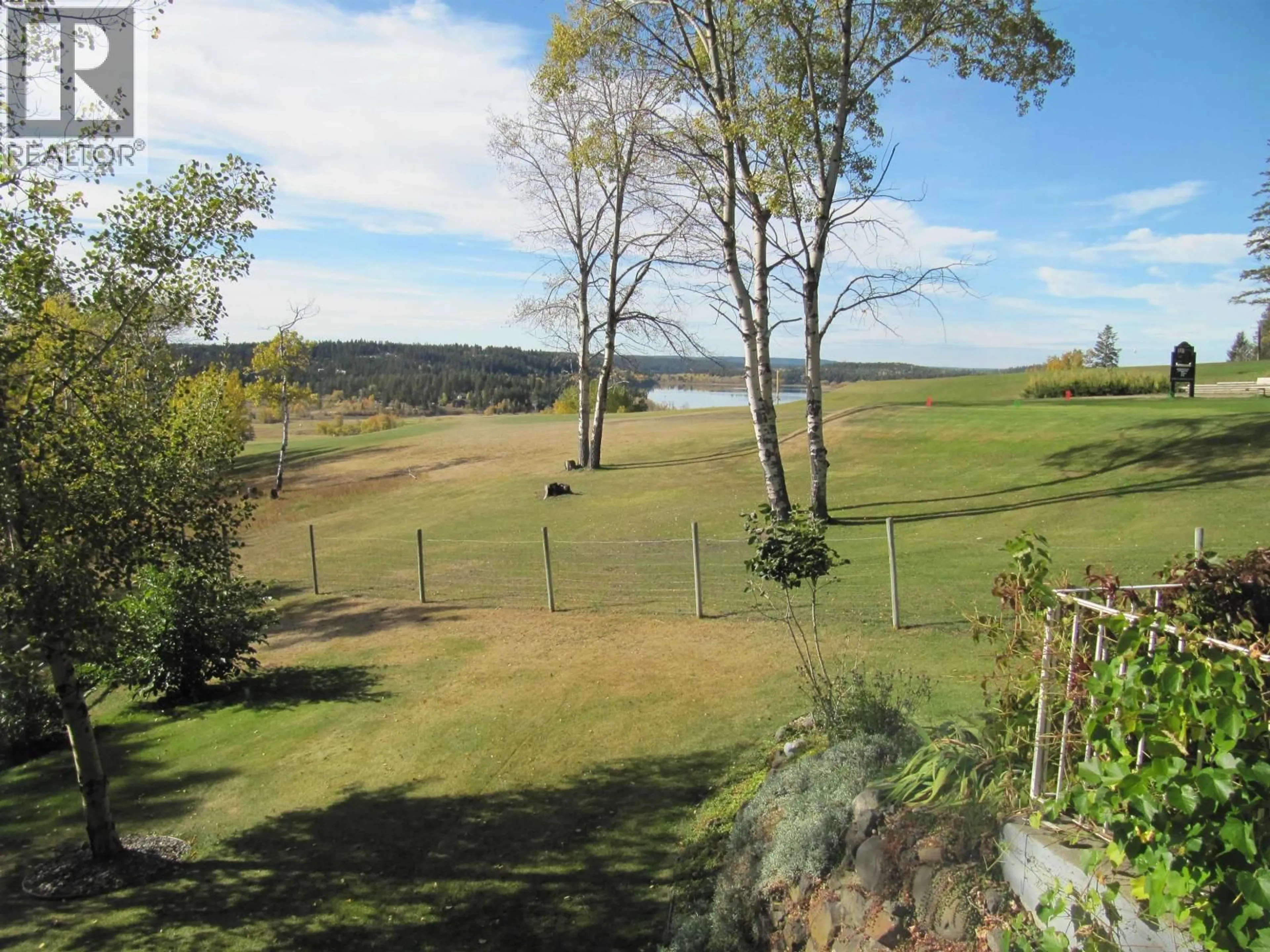 A pic from outside/outdoor area/front of a property/back of a property/a pic from drone, water/lake/river/ocean view for 4838 TELQUA DRIVE, 108 Mile Ranch British Columbia V0K2Z0