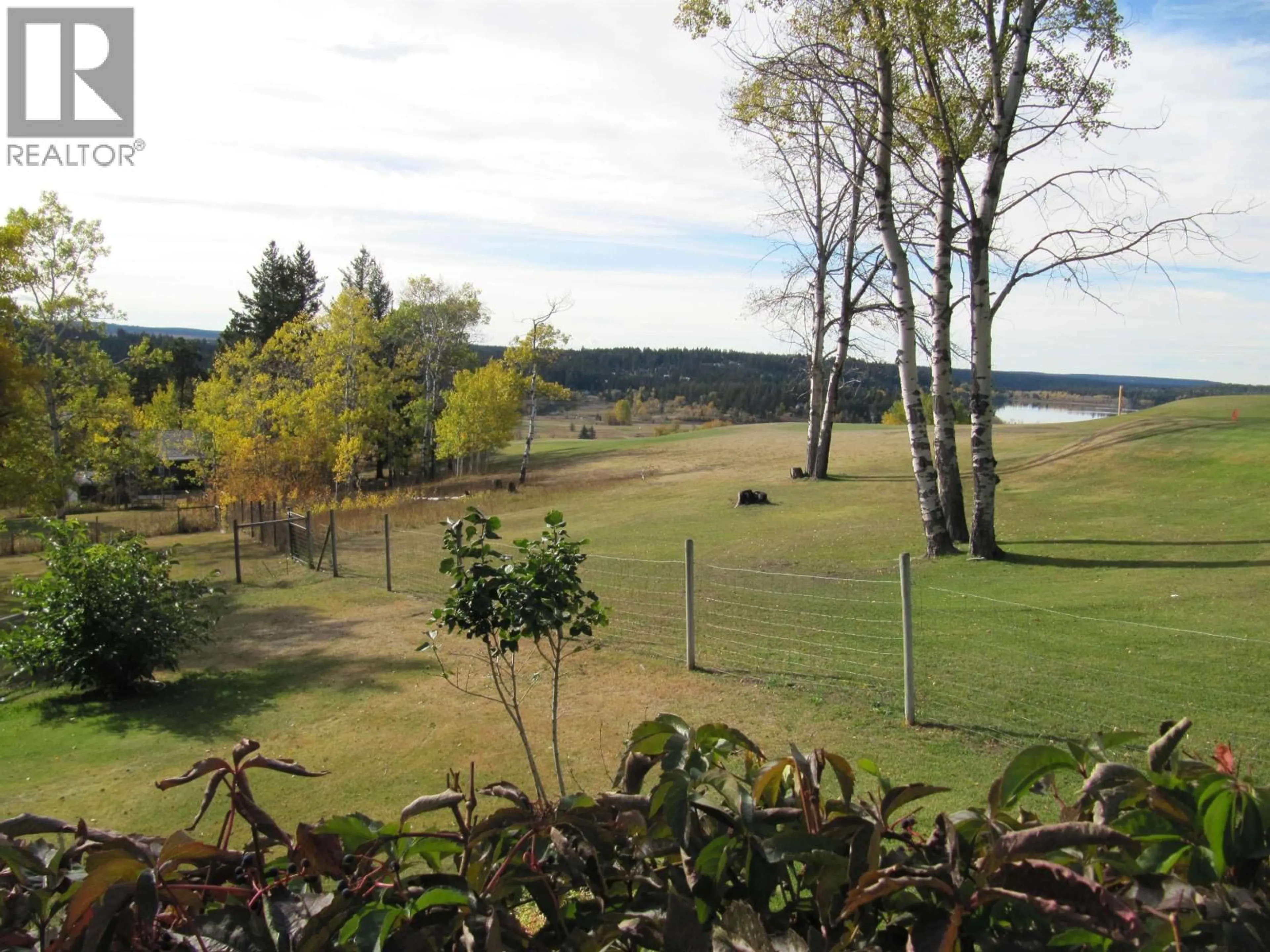 A pic from outside/outdoor area/front of a property/back of a property/a pic from drone, water/lake/river/ocean view for 4838 TELQUA DRIVE, 108 Mile Ranch British Columbia V0K2Z0