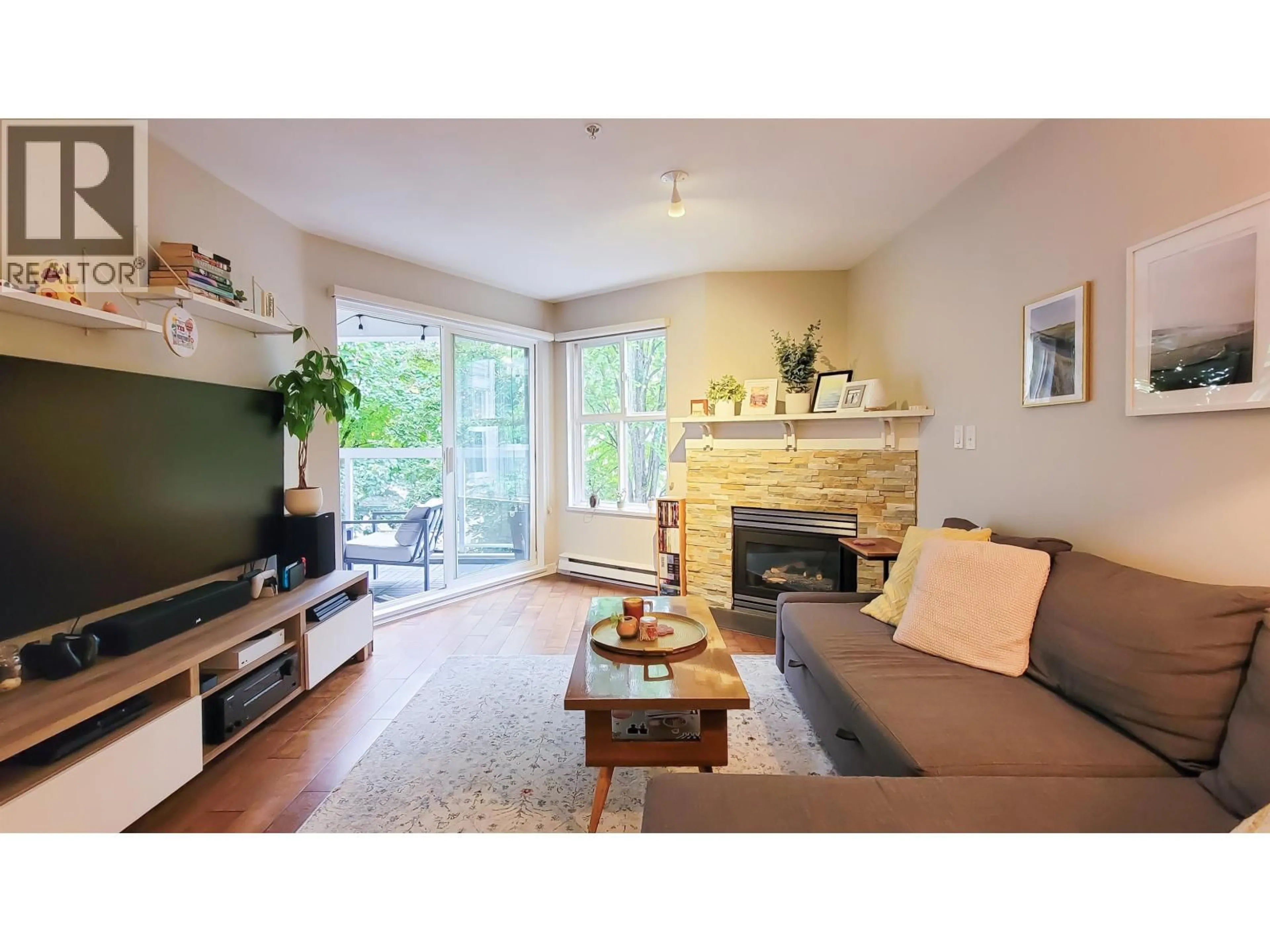 Living room with furniture, wood/laminate floor for 214 - 3038 KENT AVENUE SOUTH E, Vancouver British Columbia V5S4V8