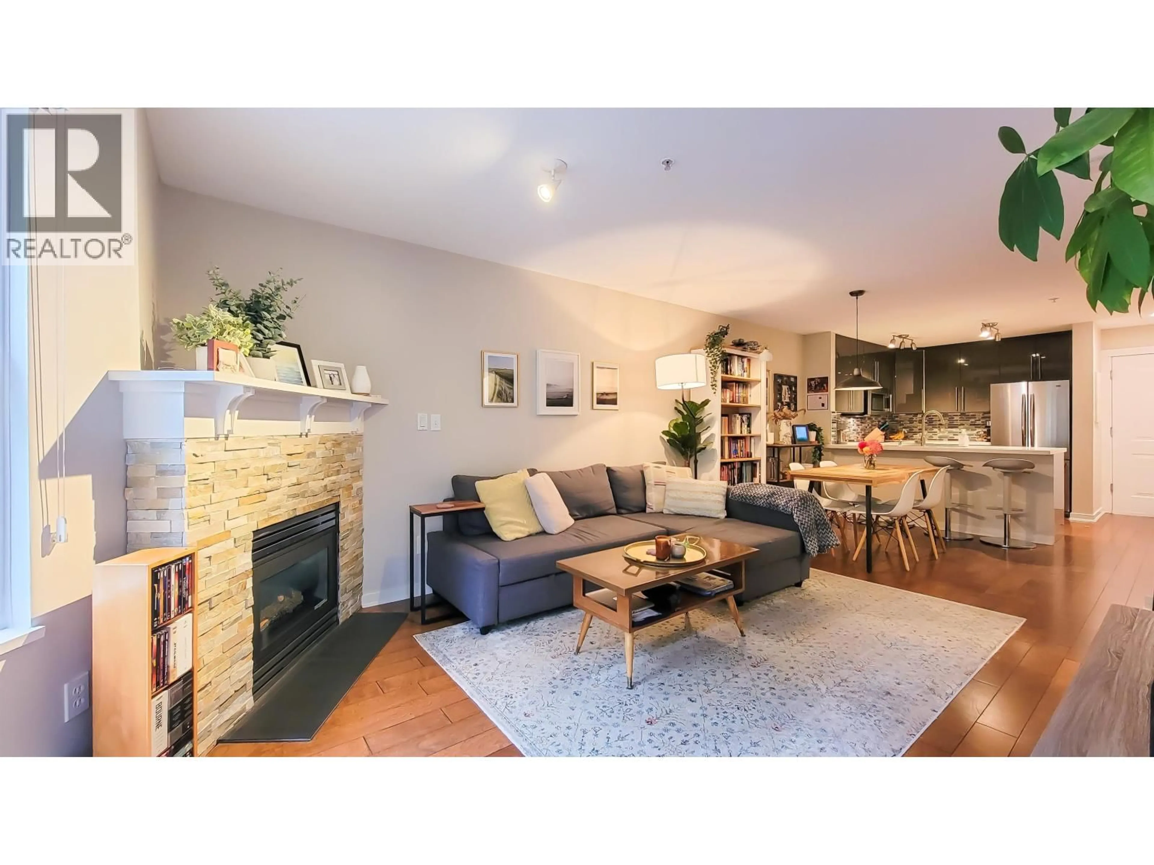 Living room with furniture, wood/laminate floor for 214 - 3038 KENT AVENUE SOUTH E, Vancouver British Columbia V5S4V8