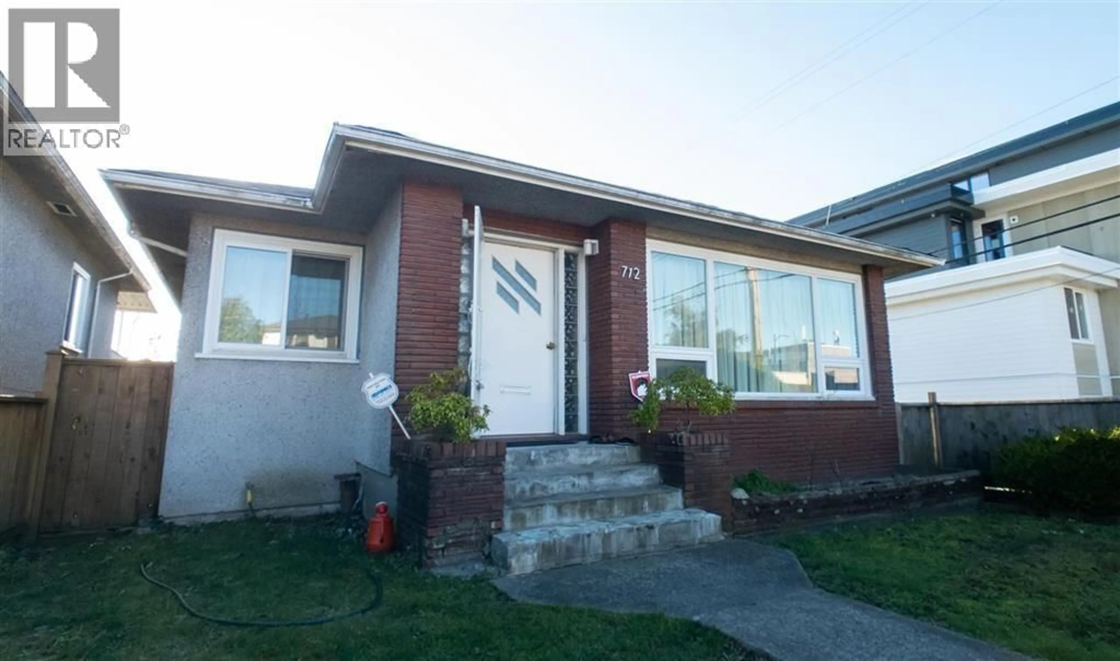 Home with vinyl exterior material, street for 712 57 AVENUE, Vancouver British Columbia V5X1T2