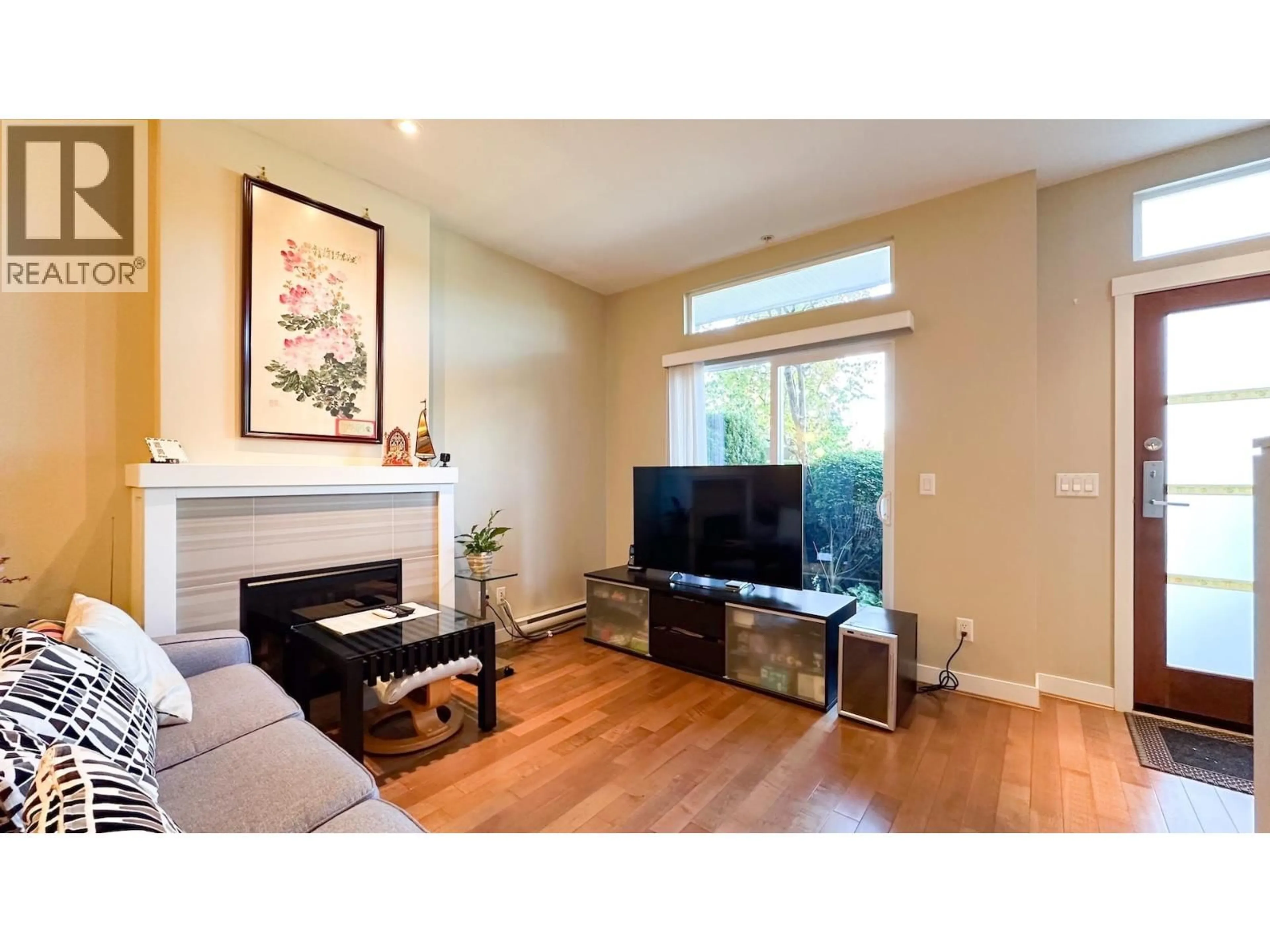 Living room with furniture, wood/laminate floor for 22 - 3788 LAUREL STREET, Burnaby British Columbia V5G1M7