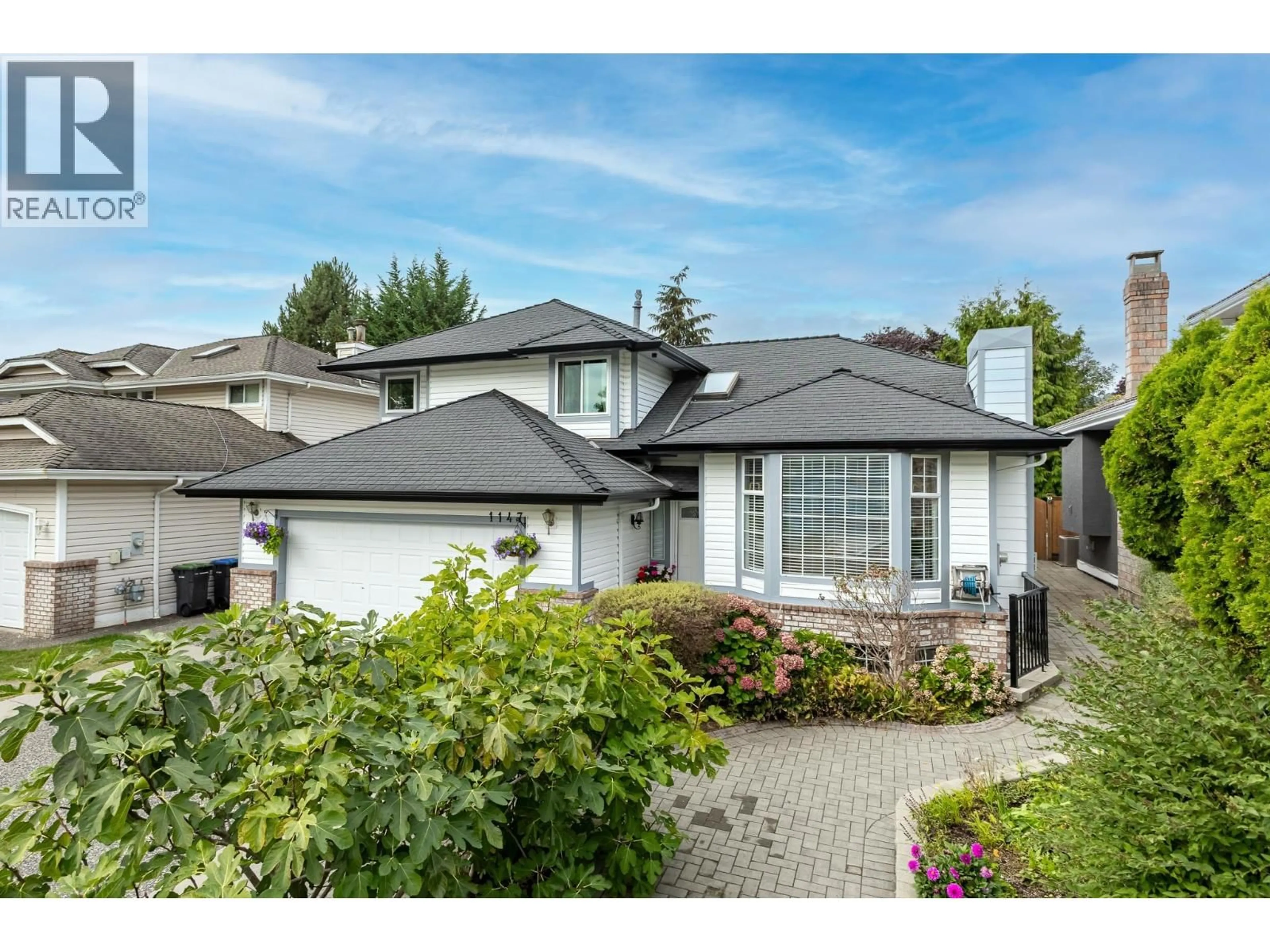 Home with vinyl exterior material, street for 1147 CONFEDERATION DRIVE, Port Coquitlam British Columbia V3C5Y6