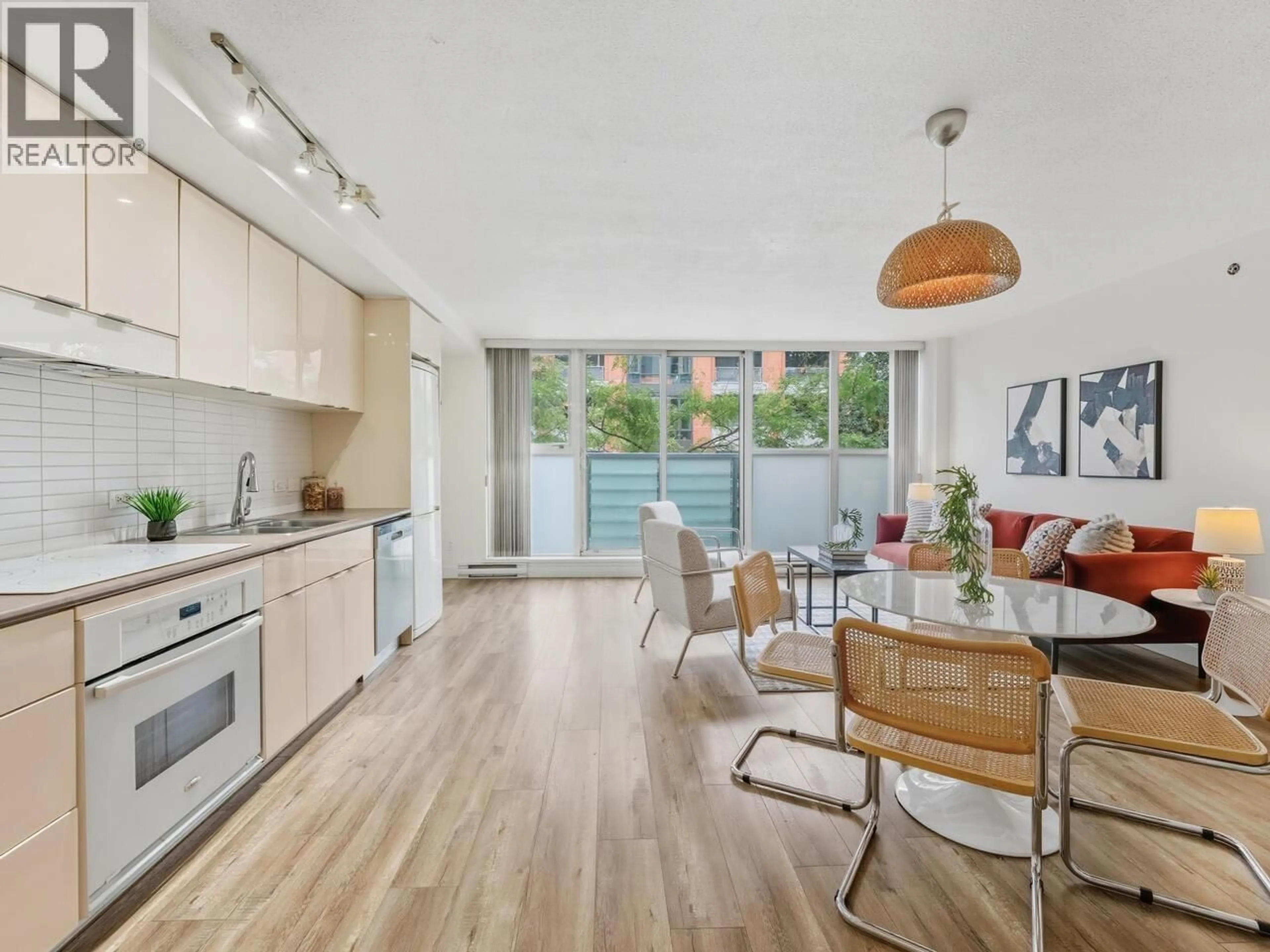 Open concept kitchen, wood/laminate floor for 209 - 168 POWELL STREET, Vancouver British Columbia V6A0B2