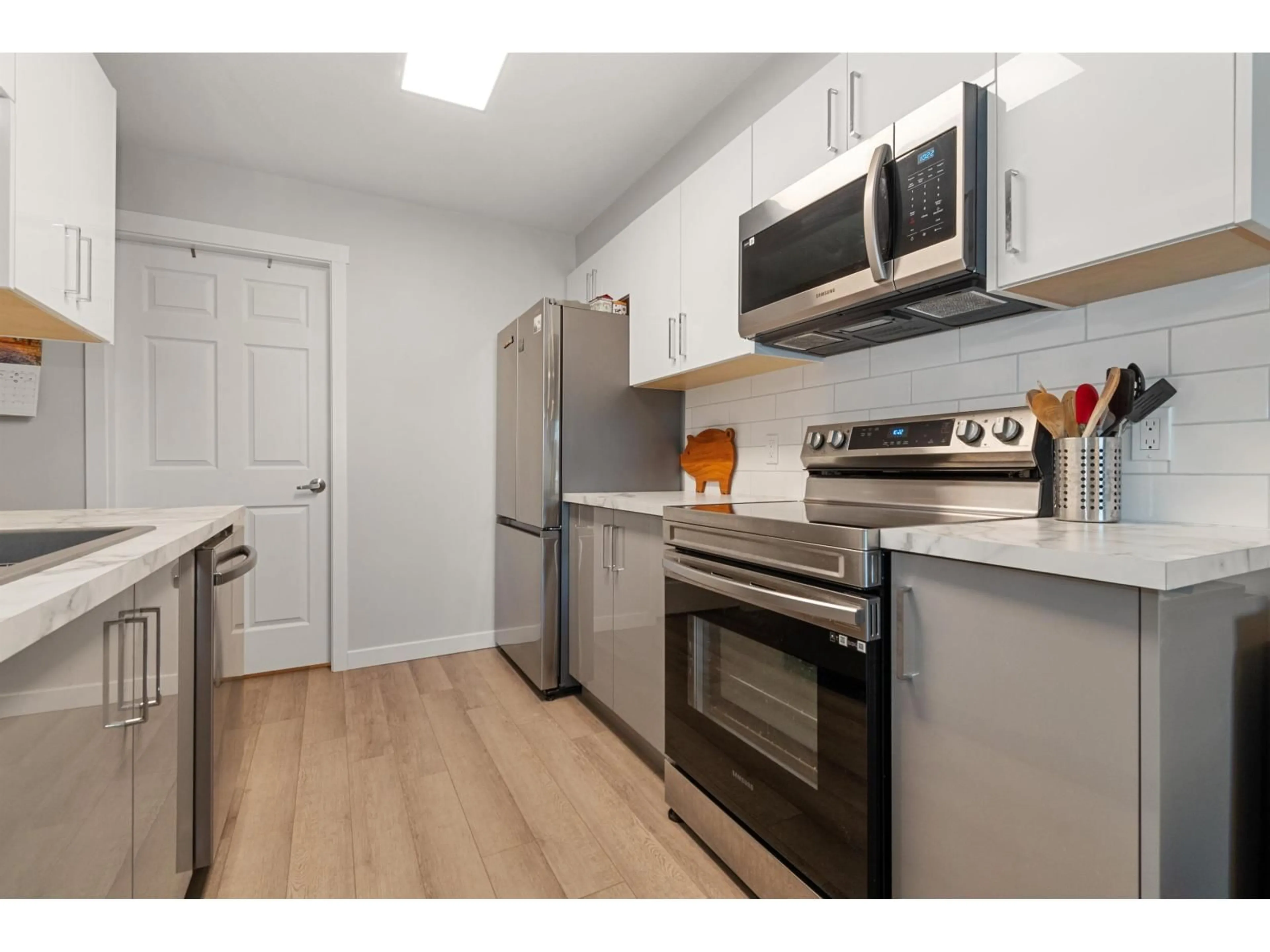 Standard kitchen, wood/laminate floor for 411 - 7694 EVANS ROAD, Chilliwack British Columbia V2R3W3