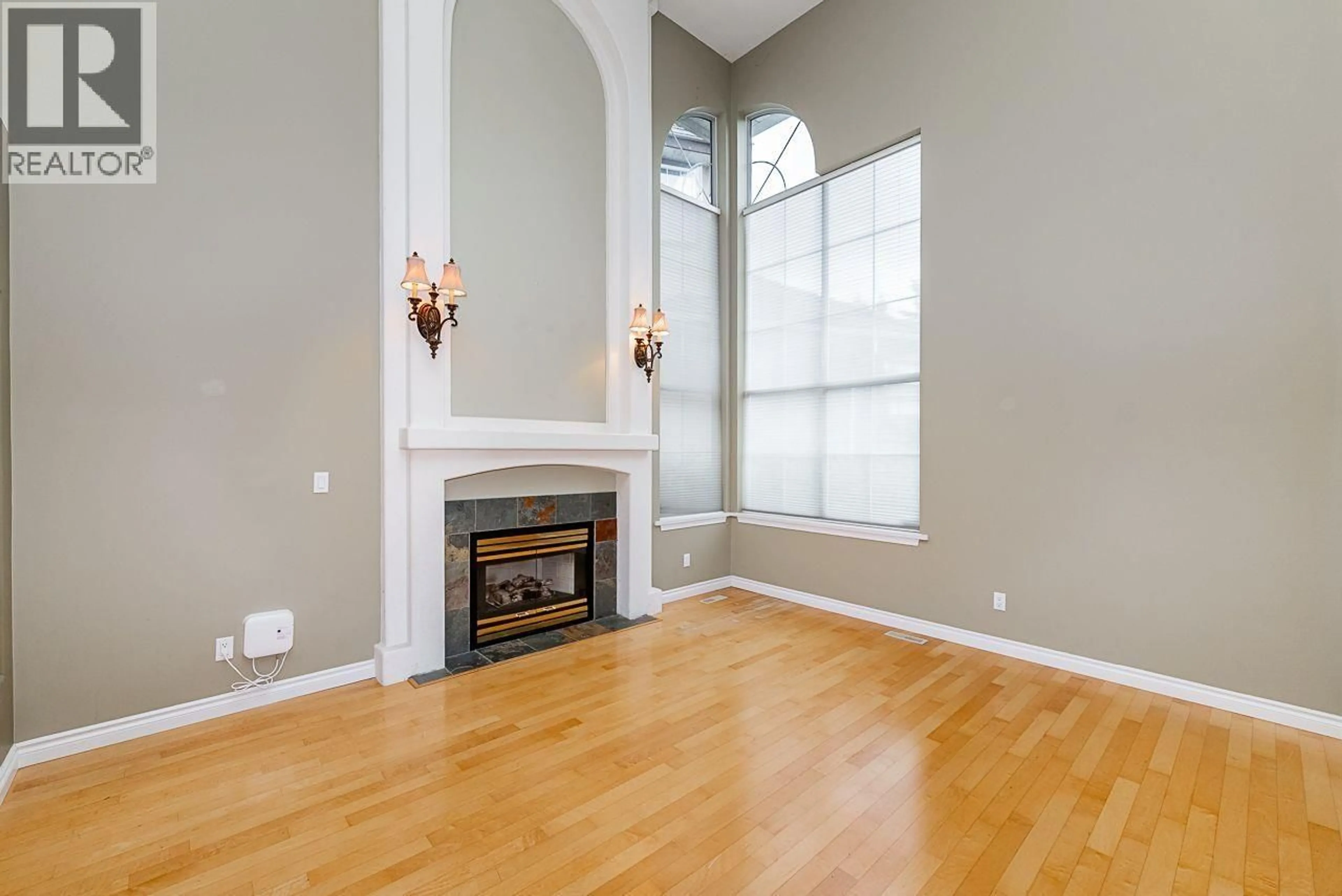 Living room with furniture, wood/laminate floor for 1580 WINTERGREEN PLACE, Coquitlam British Columbia V3E2V5