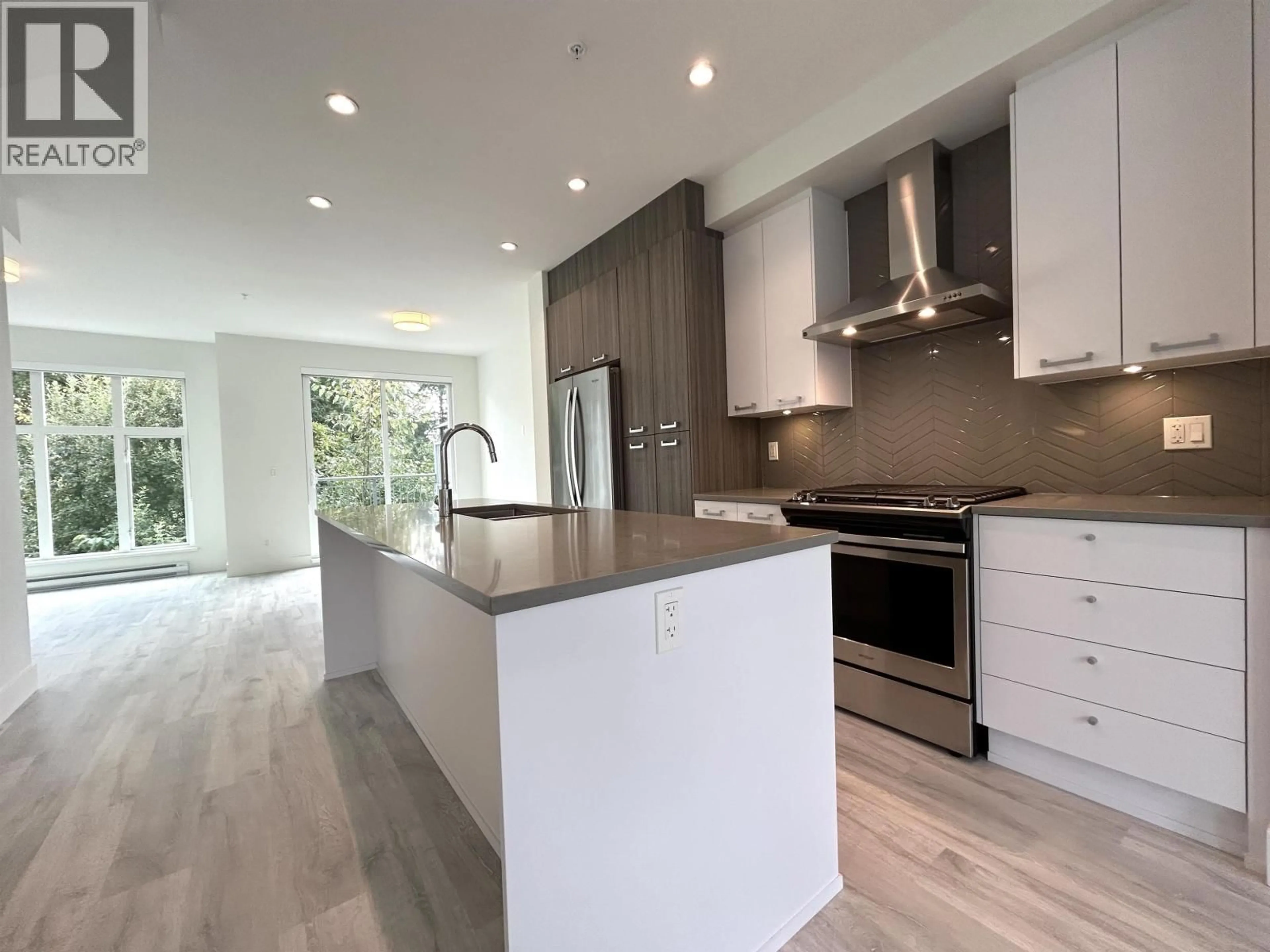 Open concept kitchen, wood/laminate floor for 128 - 24076 112 AVENUE, Maple Ridge British Columbia V2W0K2