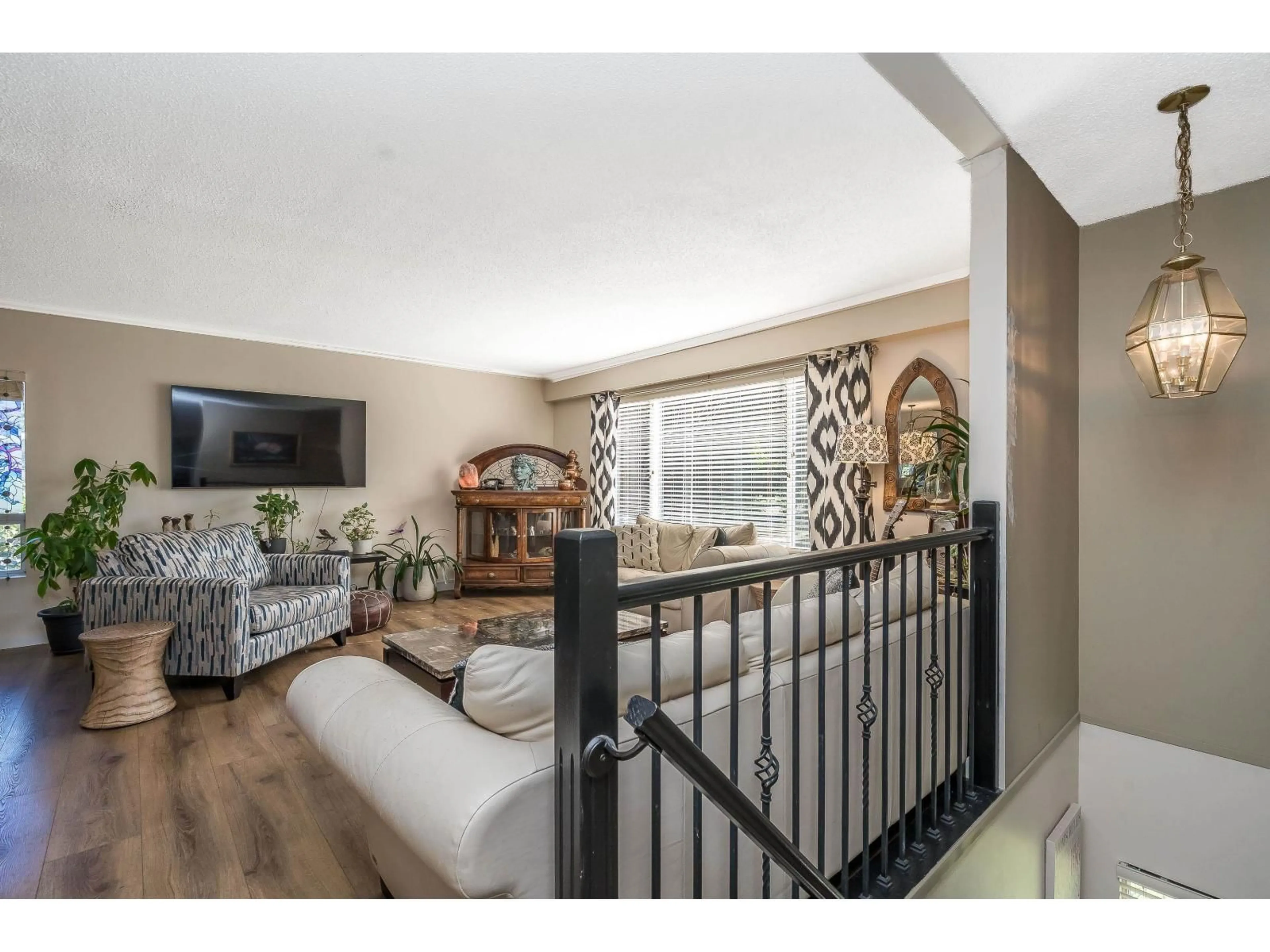 Living room with furniture, wood/laminate floor for 20651 44, Langley British Columbia V3A3E5