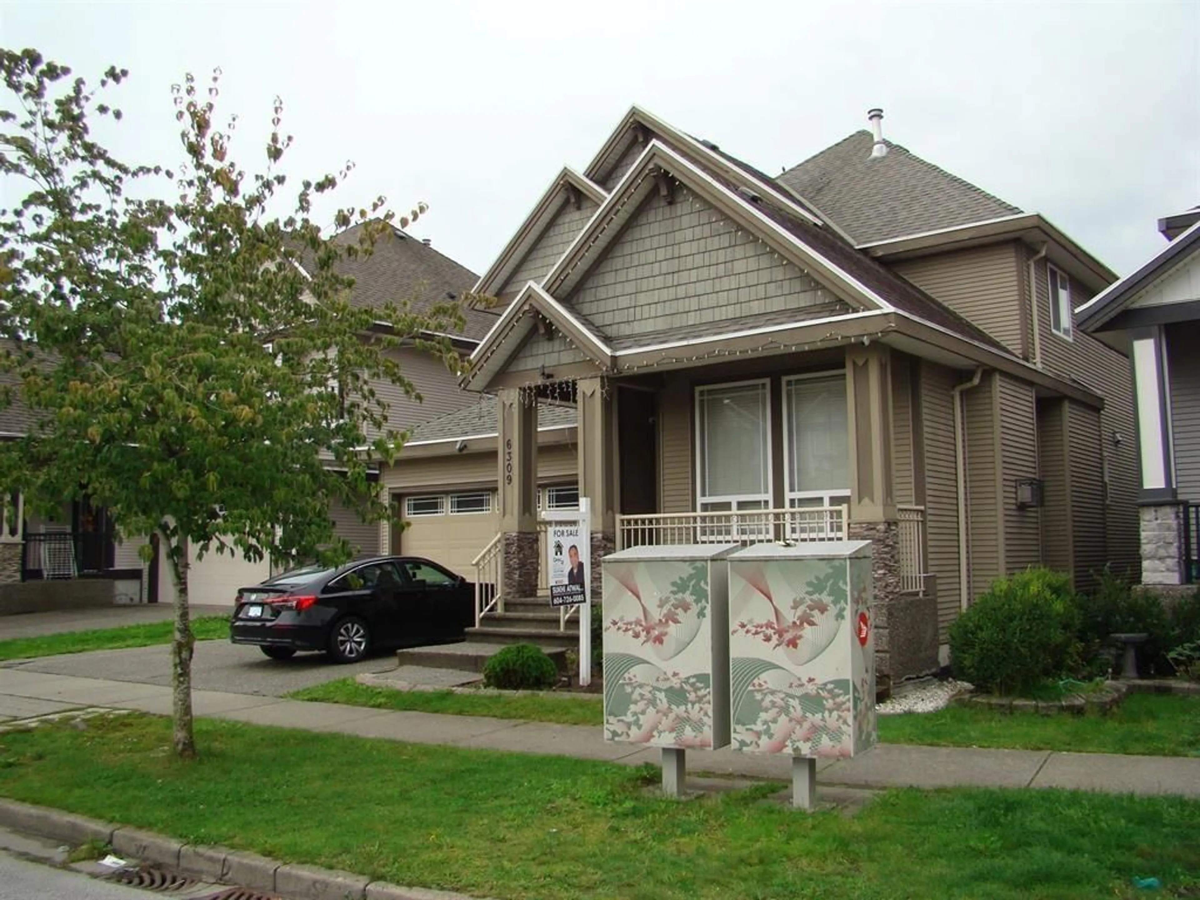 Home with vinyl exterior material, street for 6309 167B, Surrey British Columbia V3S1X3