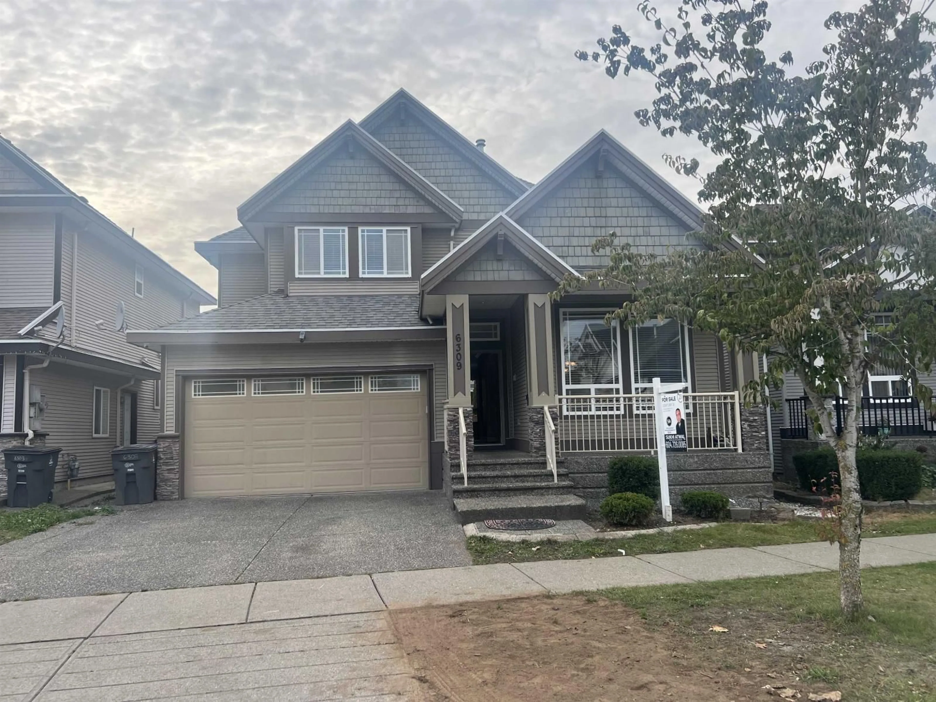 Home with vinyl exterior material, street for 6309 167B, Surrey British Columbia V3S1X3