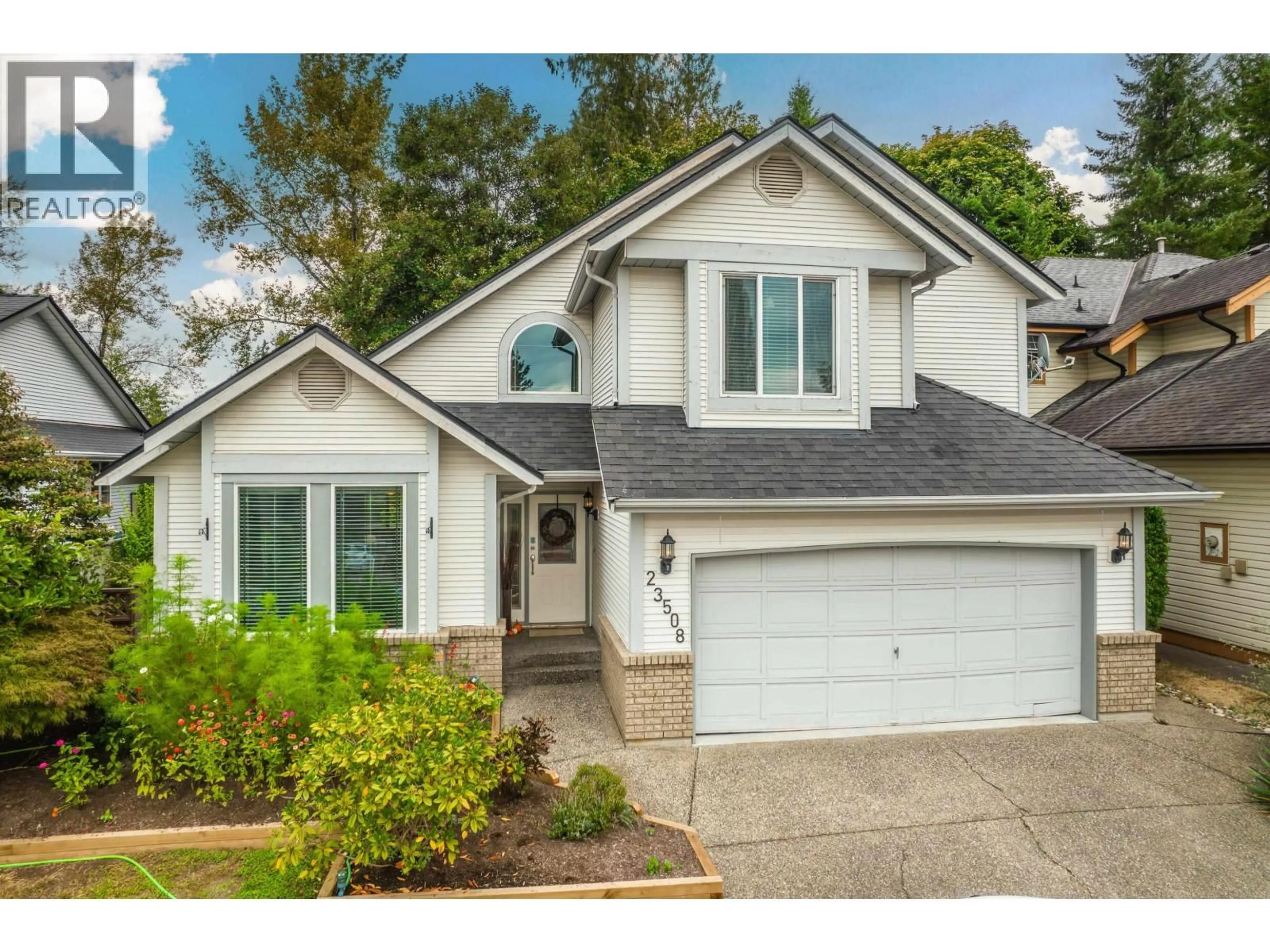 Home with vinyl exterior material, street for 23508 TAMARACK LANE, Maple Ridge British Columbia V2W1A9