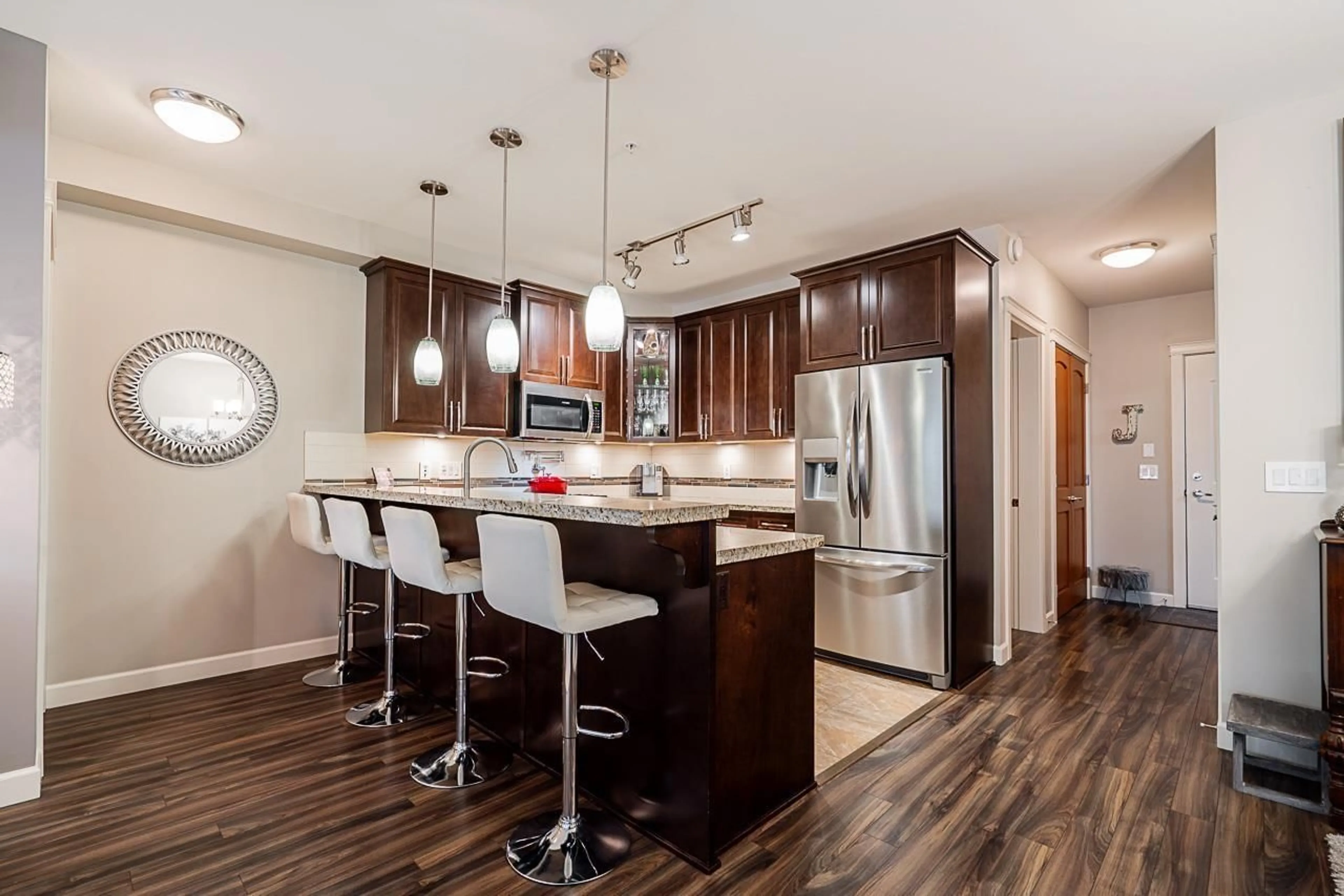 Open concept kitchen, wood/laminate floor for B323 - 8218 207A, Langley British Columbia V2Y0Y1