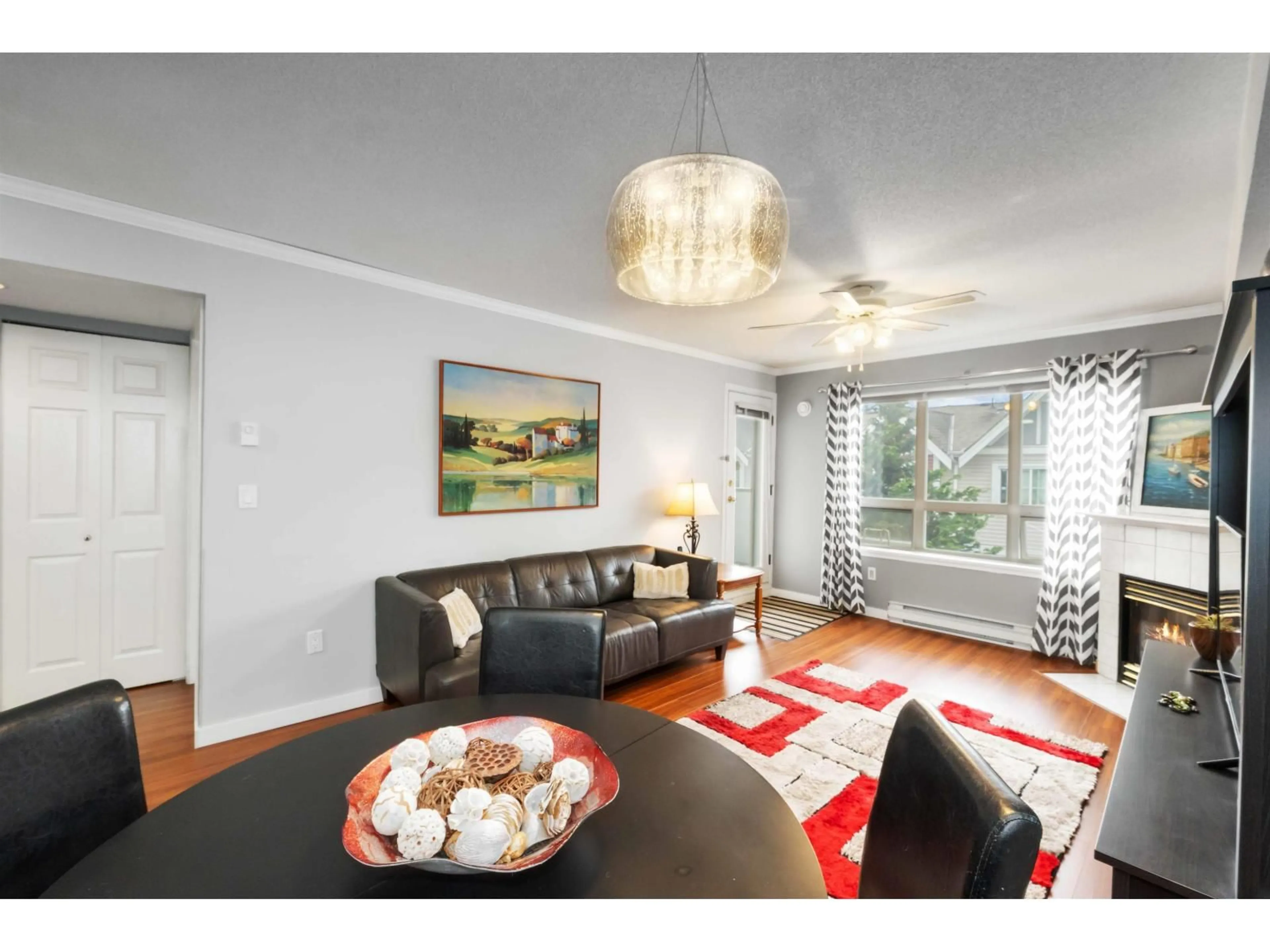 Living room with furniture, wood/laminate floor for 308 - 14355 103, Surrey British Columbia V3T5V5