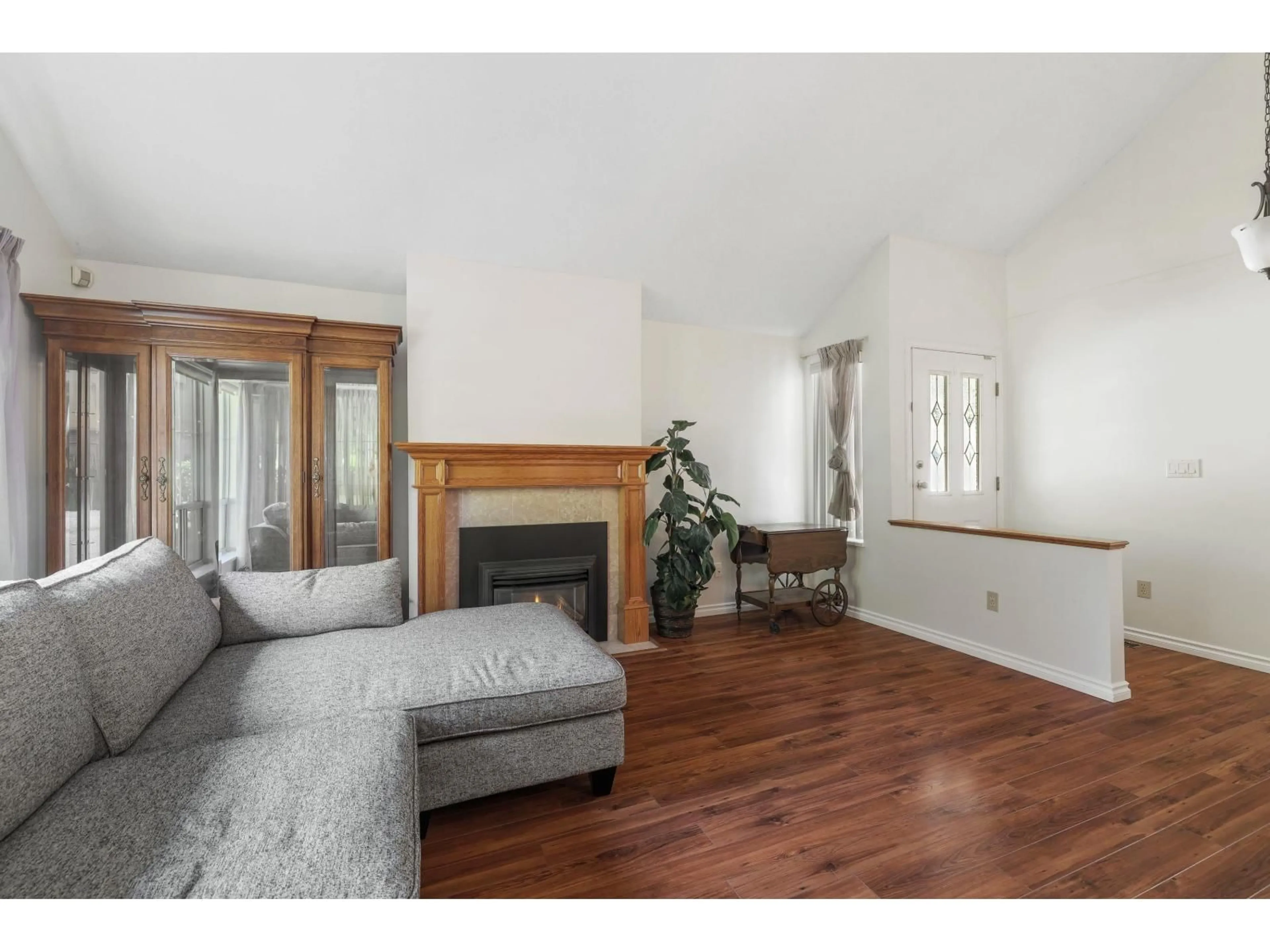 Living room with furniture, wood/laminate floor for 67 - 6140 192, Surrey British Columbia V3S7V7