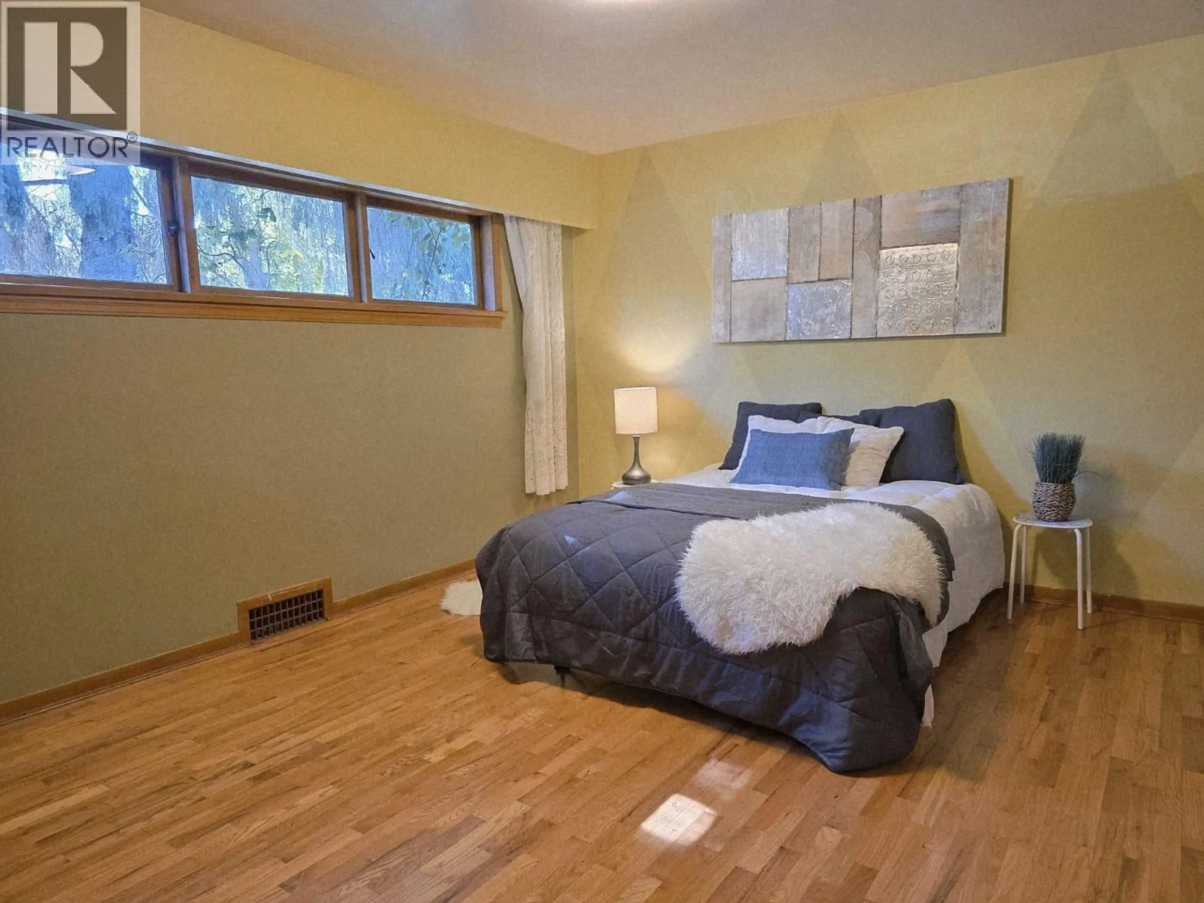 Bedroom with bed, wood/laminate floor for 2725 52ND AVENUE, Vancouver British Columbia V5S1S9
