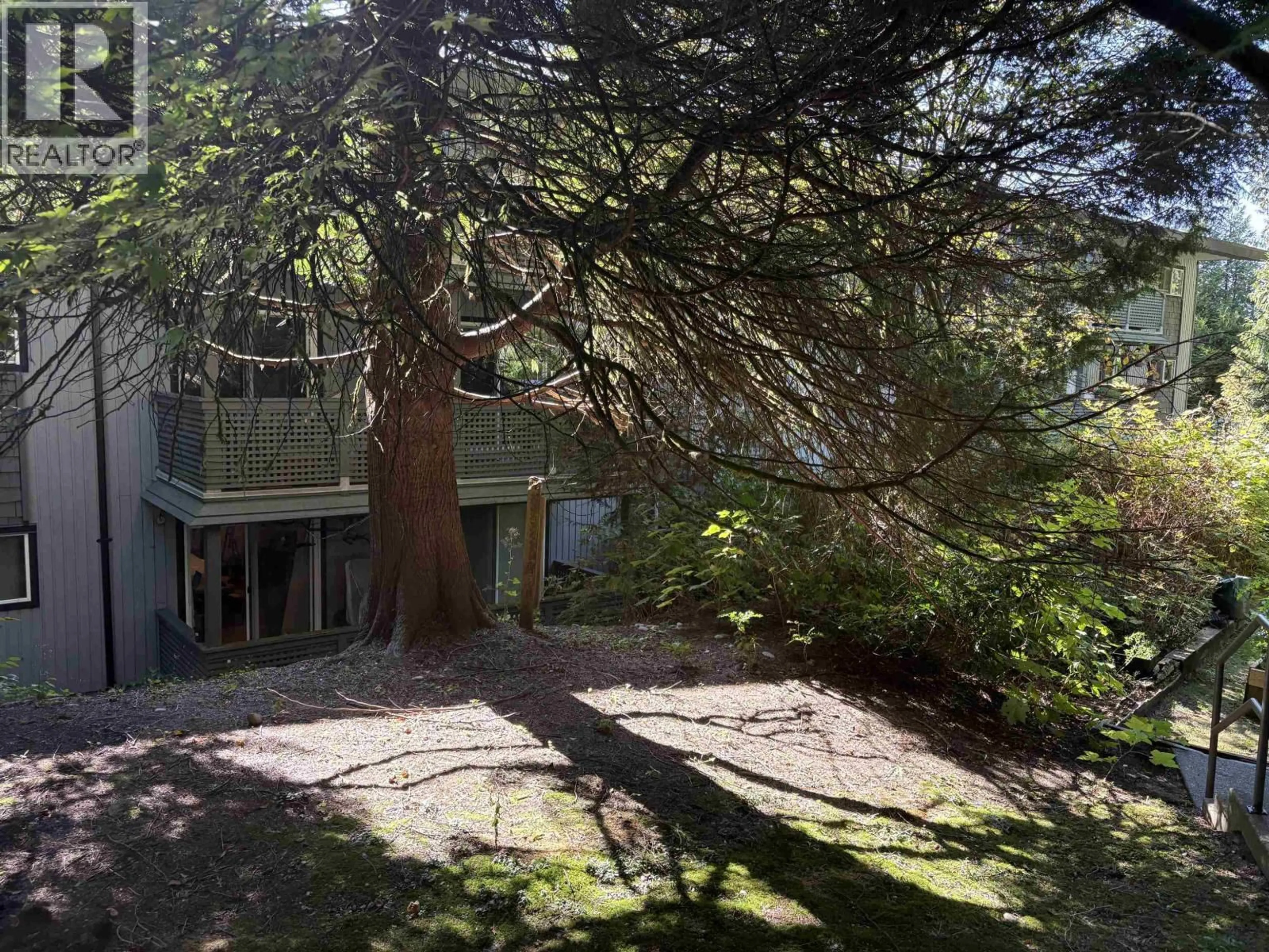 A pic from outside/outdoor area/front of a property/back of a property/a pic from drone, forest/trees view for 108 - 200 WESTHILL PLACE, Port Moody British Columbia V3H1V2