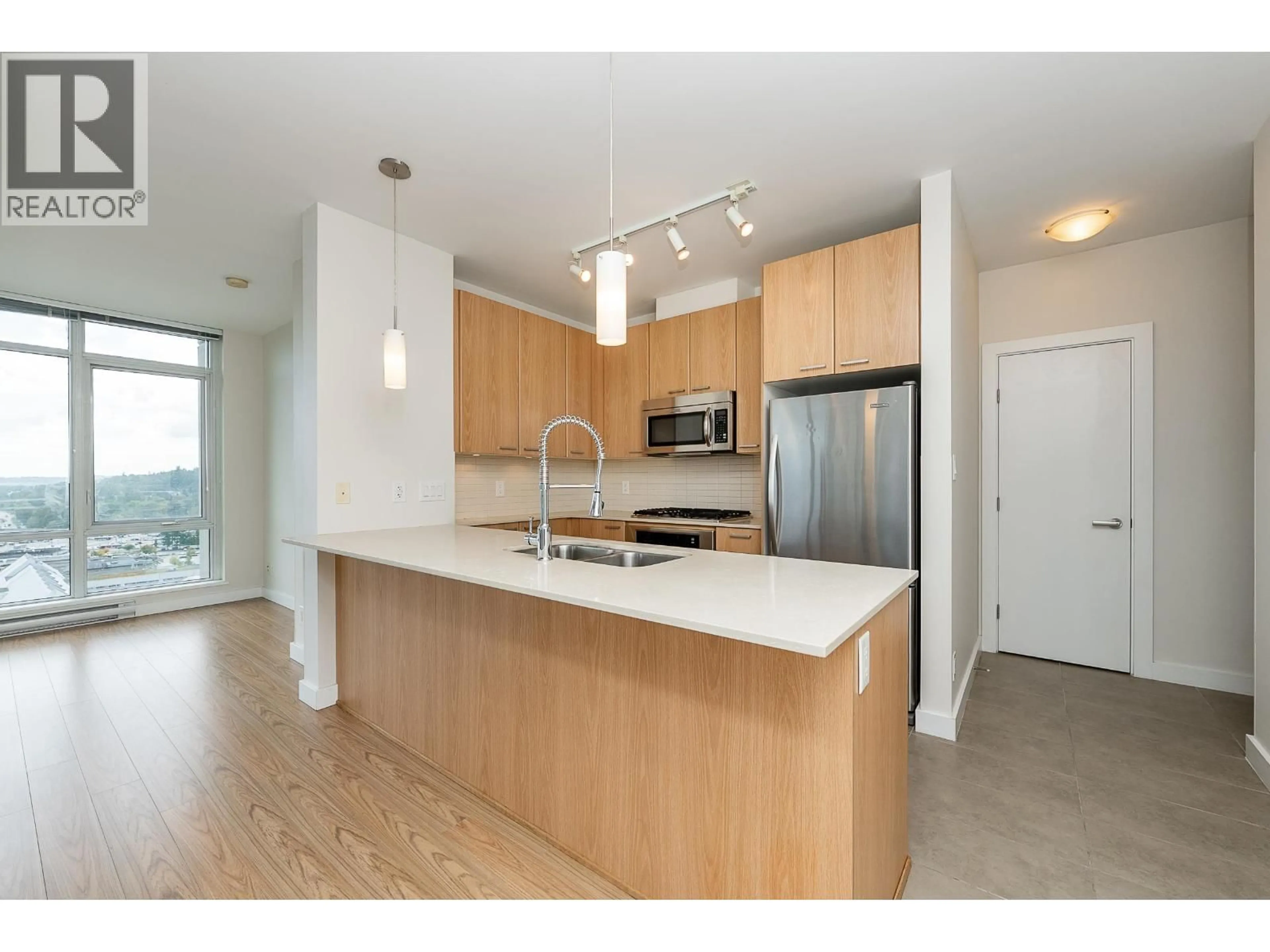 Open concept kitchen, wood/laminate floor for 2105 - 2955 ATLANTIC AVENUE, Coquitlam British Columbia V3B0H9