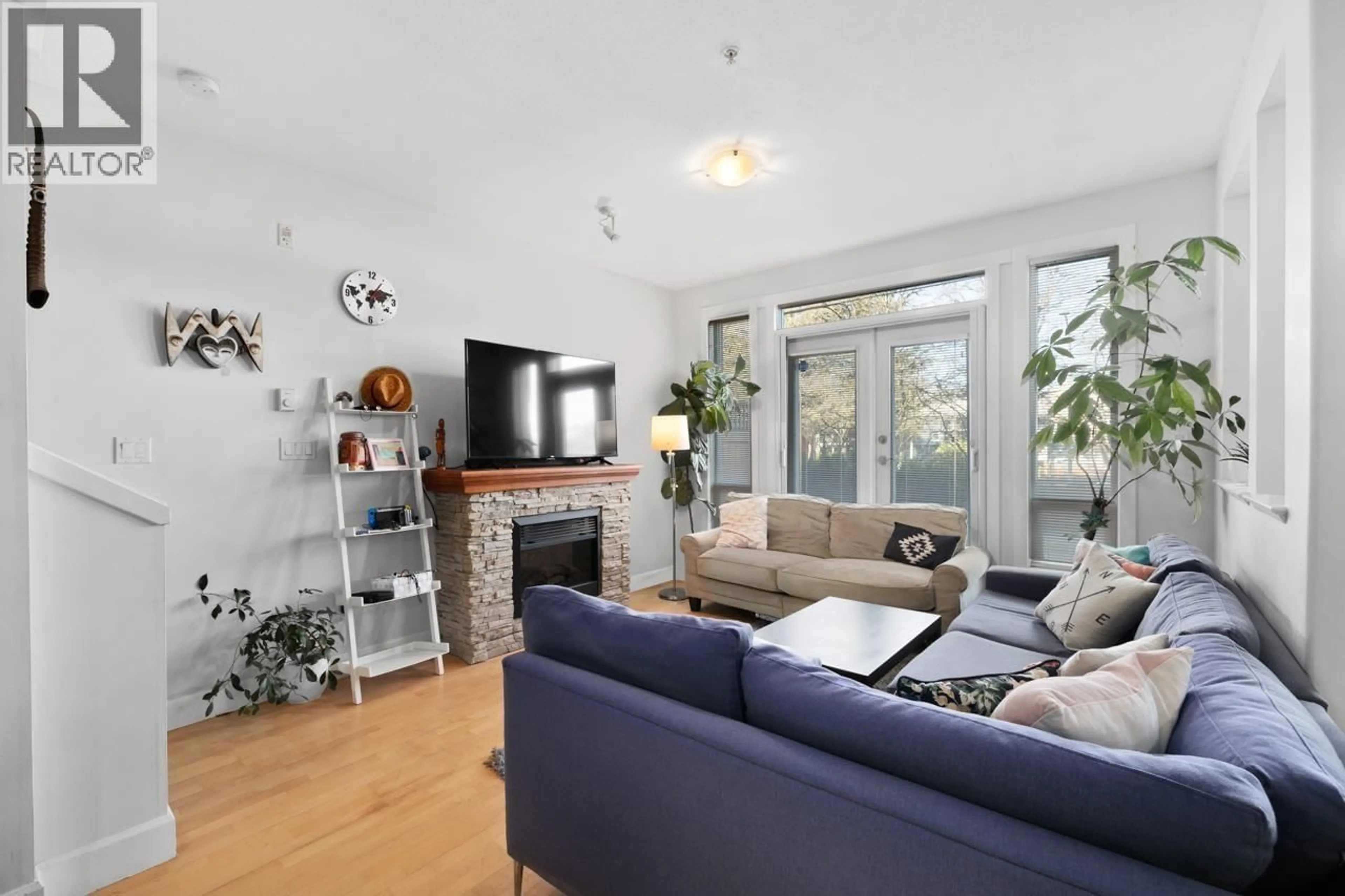 Living room with furniture, wood/laminate floor for 117 - 4280 MONCTON STREET, Richmond British Columbia V7E6T4
