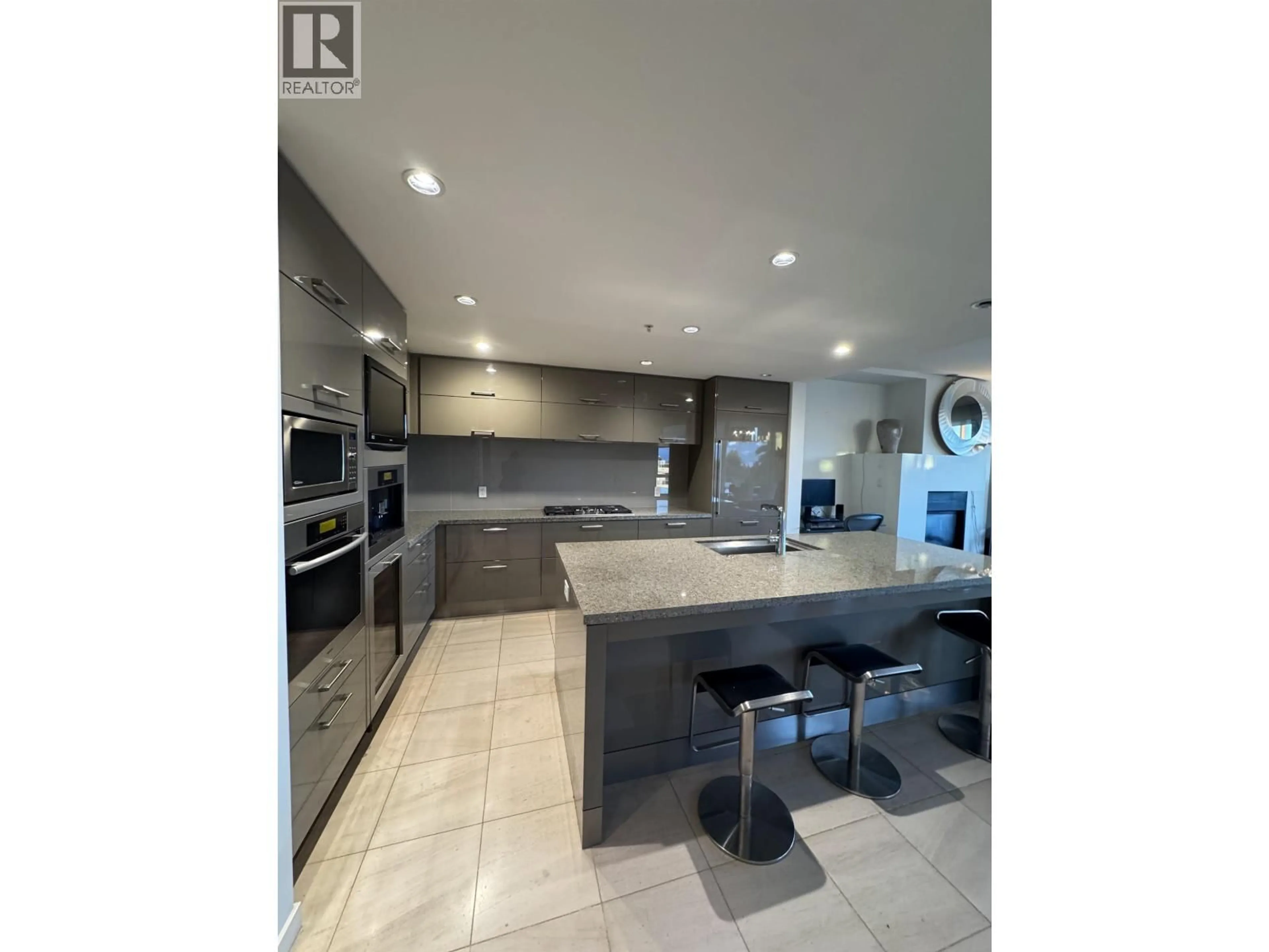 Open concept kitchen, ceramic/tile floor for 503 - 6093 IONA DRIVE, Vancouver British Columbia V6T0B2