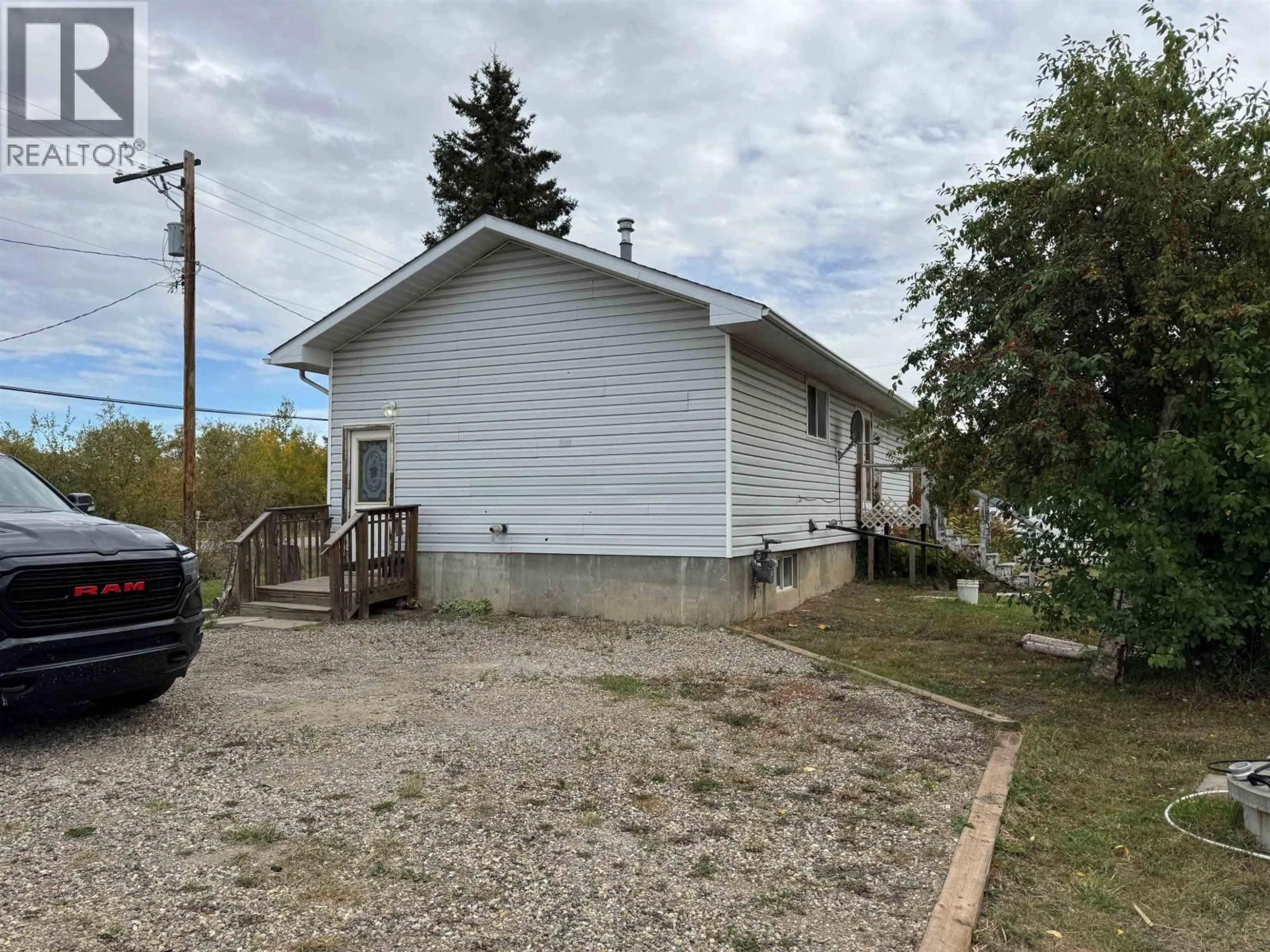 A pic from outside/outdoor area/front of a property/back of a property/a pic from drone, street for 12261 242 ROAD, Fort St. John British Columbia V2G3G5