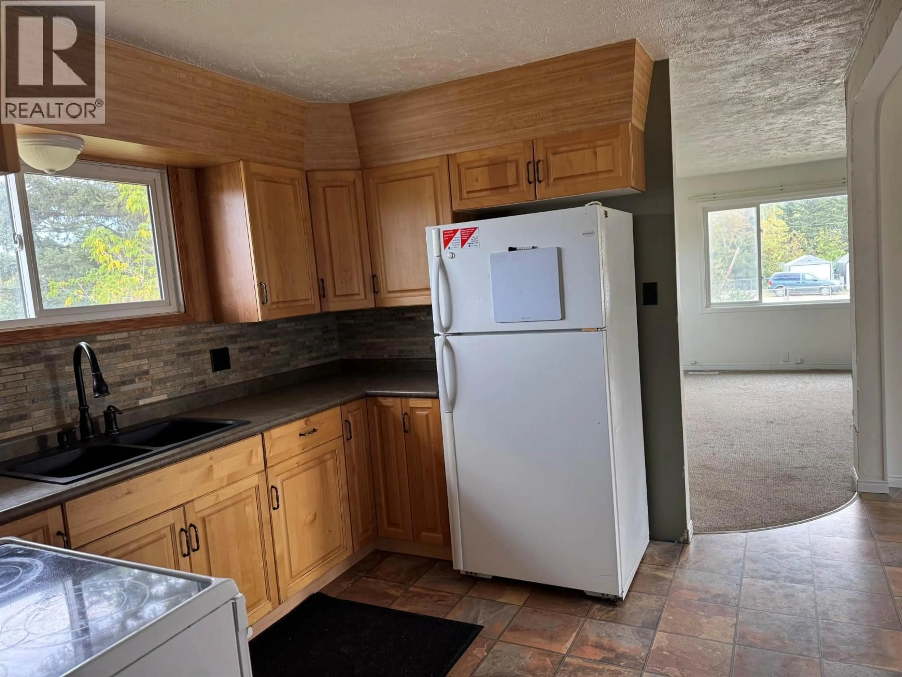 Standard kitchen, ceramic/tile floor for 12261 242 ROAD, Fort St. John British Columbia V2G3G5