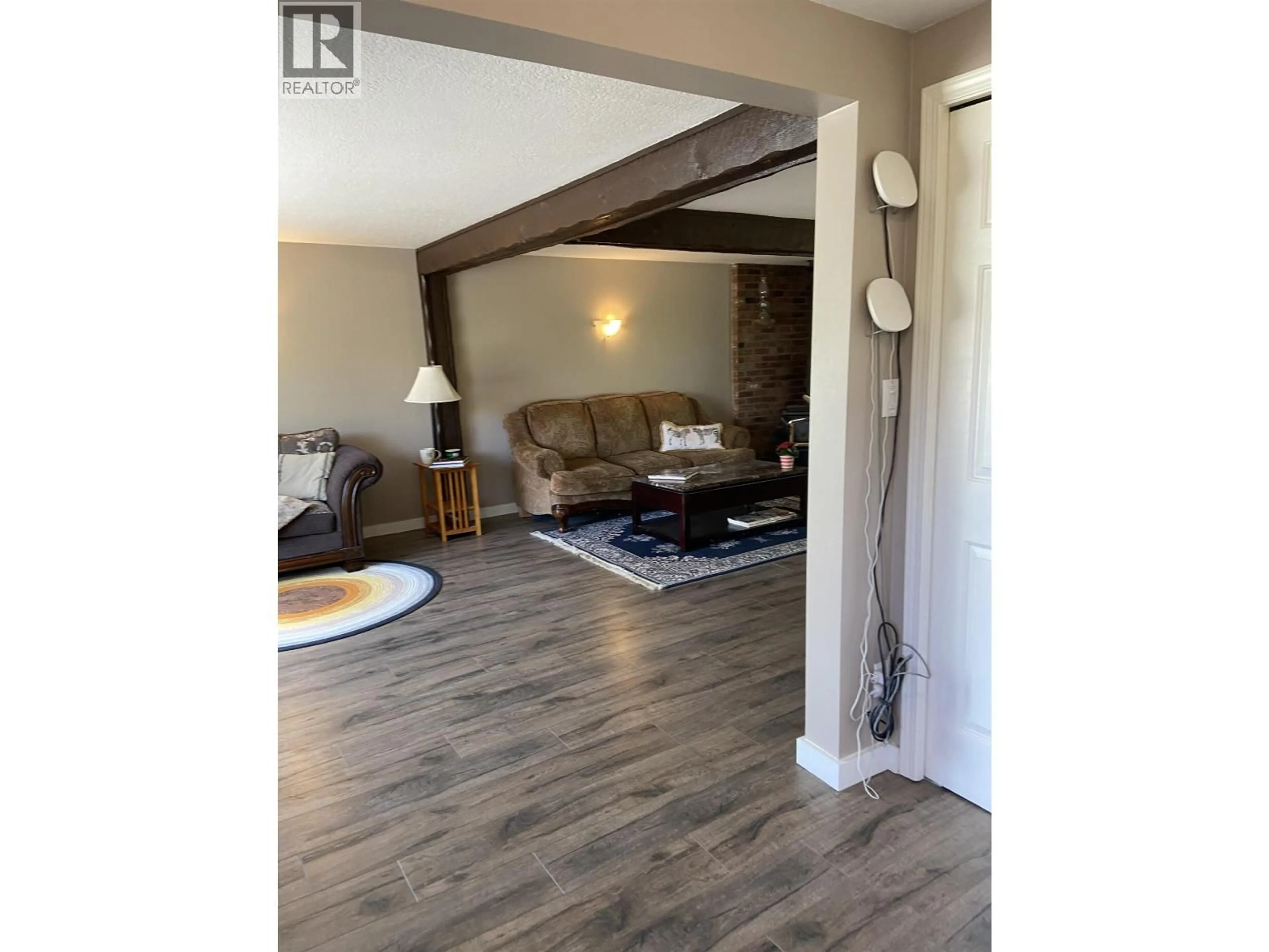 Living room with furniture, wood/laminate floor for 12279 COTTONWOOD AVENUE, Fort St. John British Columbia V1J8B1