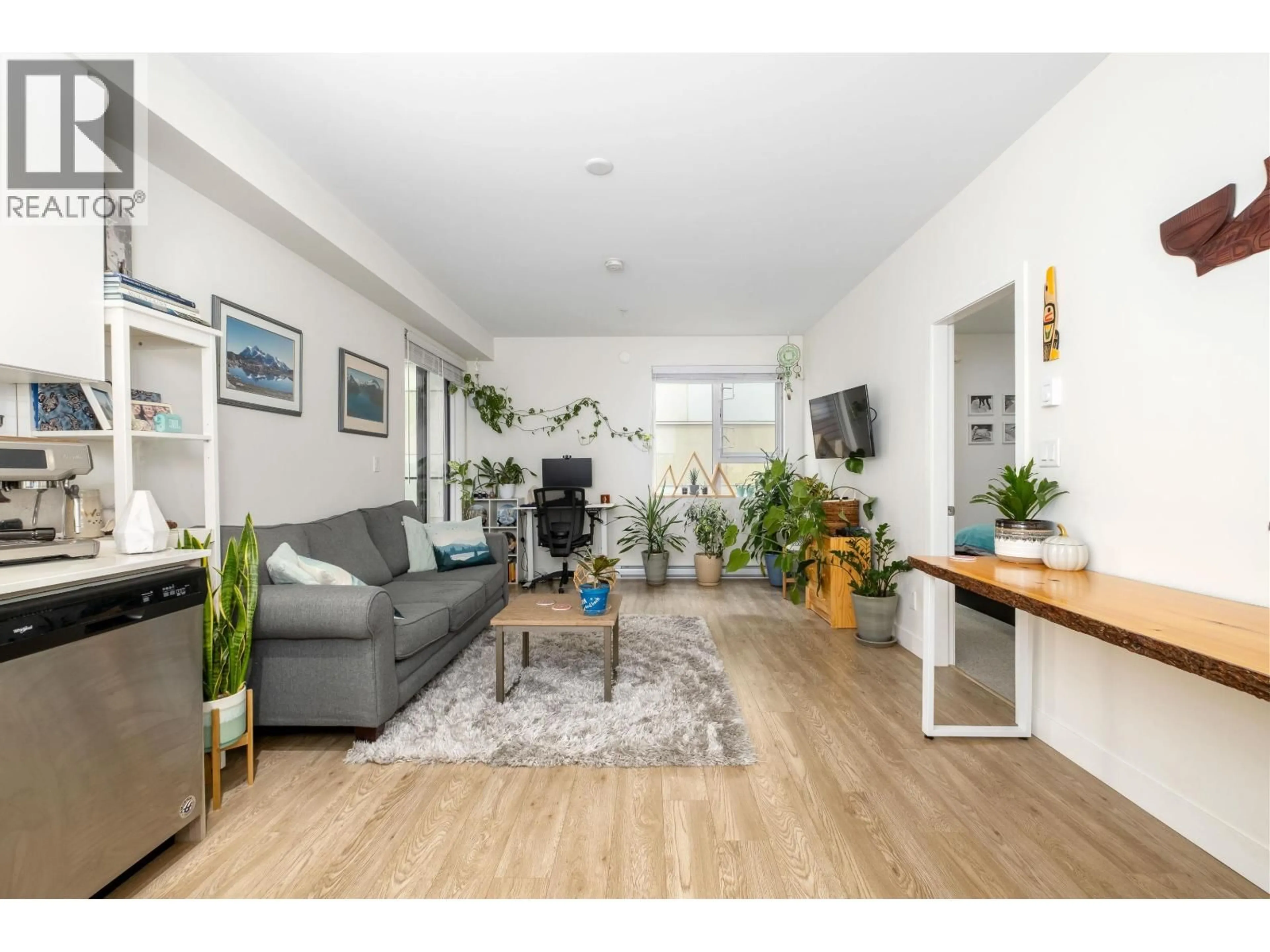 Living room with furniture, wood/laminate floor for 302 - 37881 CLEVELAND AVENUE, Squamish British Columbia V8B0Z7