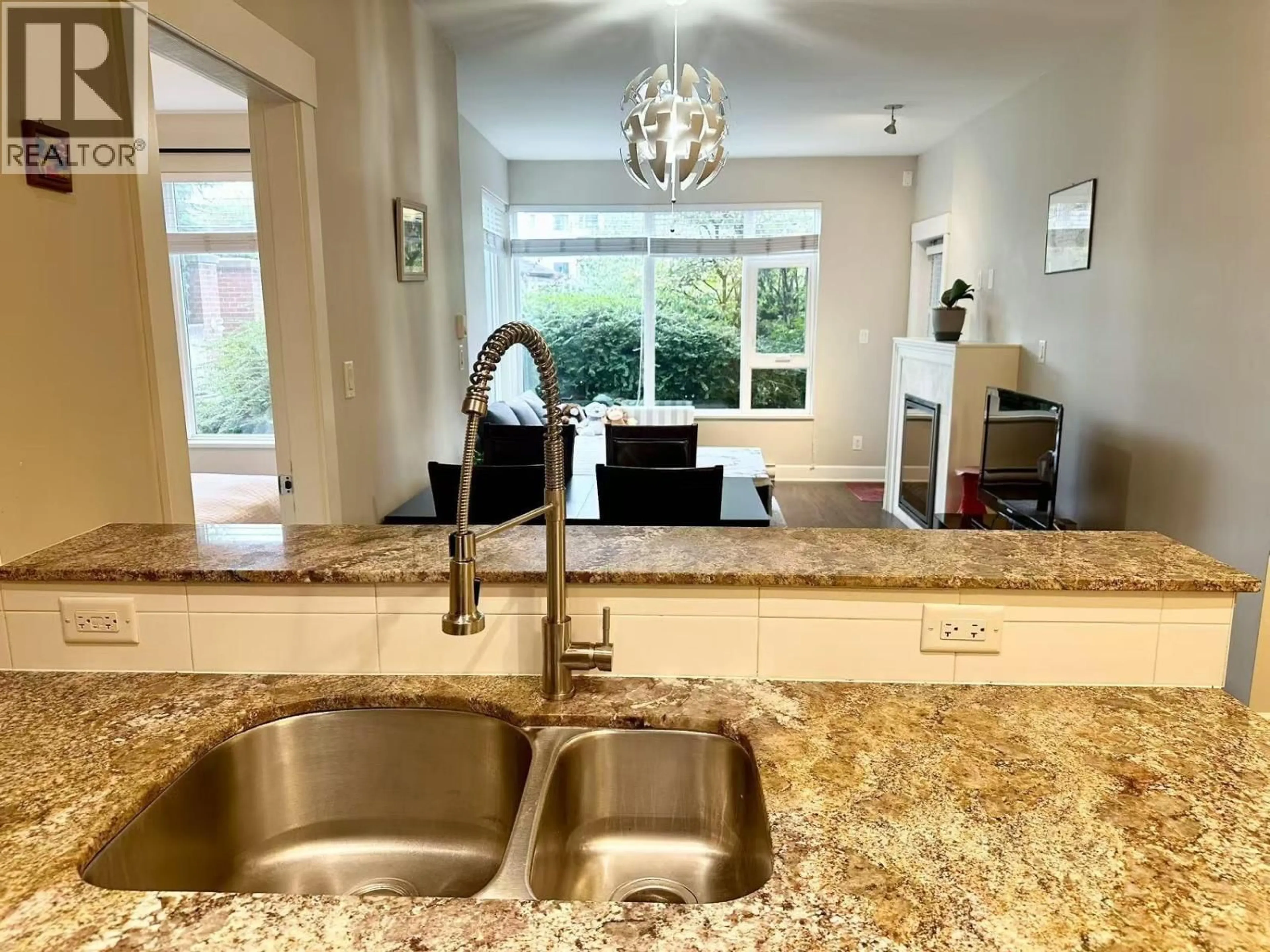 Open concept kitchen, ceramic/tile floor for 110 - 6611 ECKERSLEY ROAD, Richmond British Columbia V6Y0B7