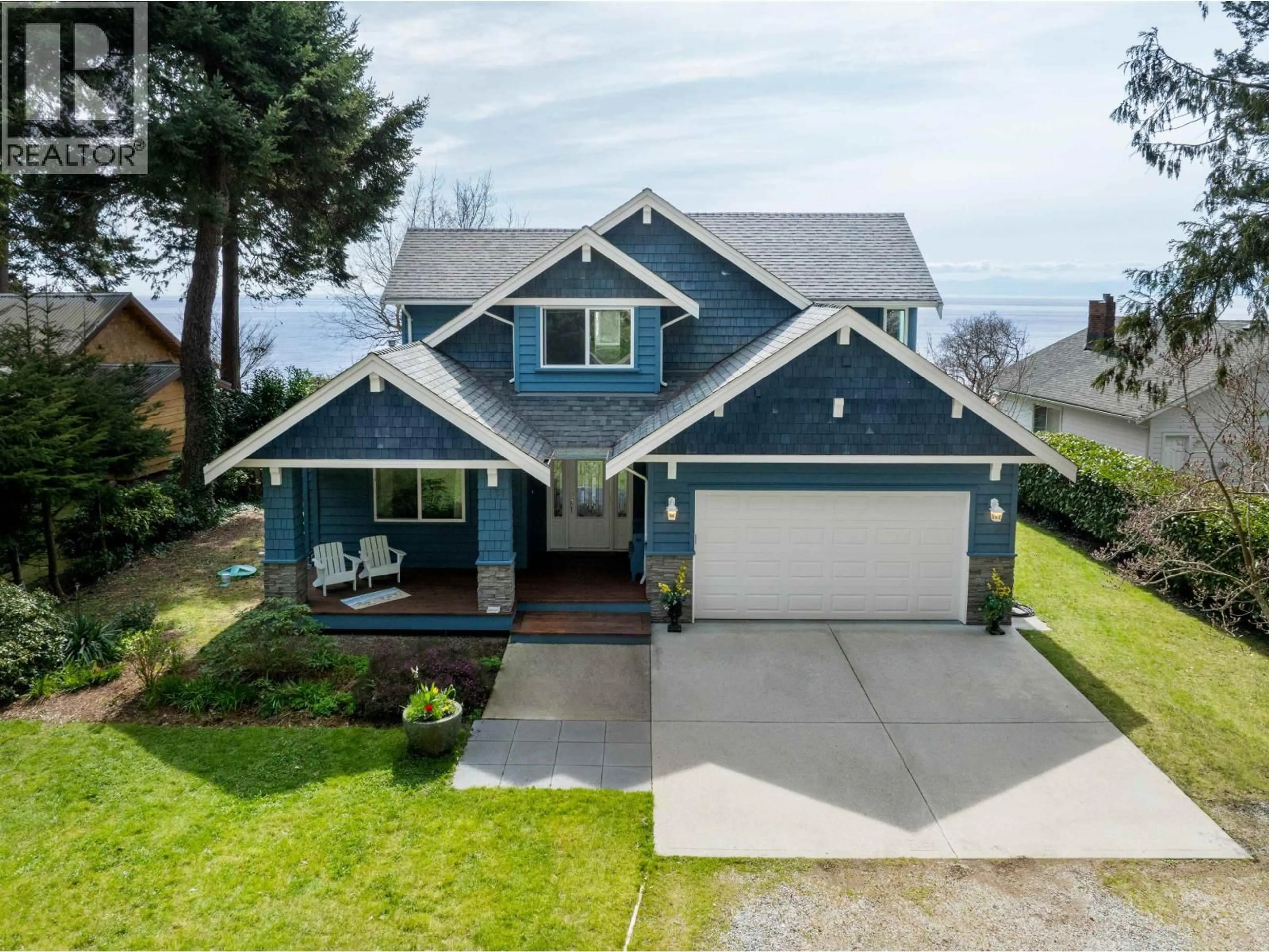 Home with vinyl exterior material, street for 1537 MCCULLOUGH ROAD, Sechelt British Columbia V7Z0A5