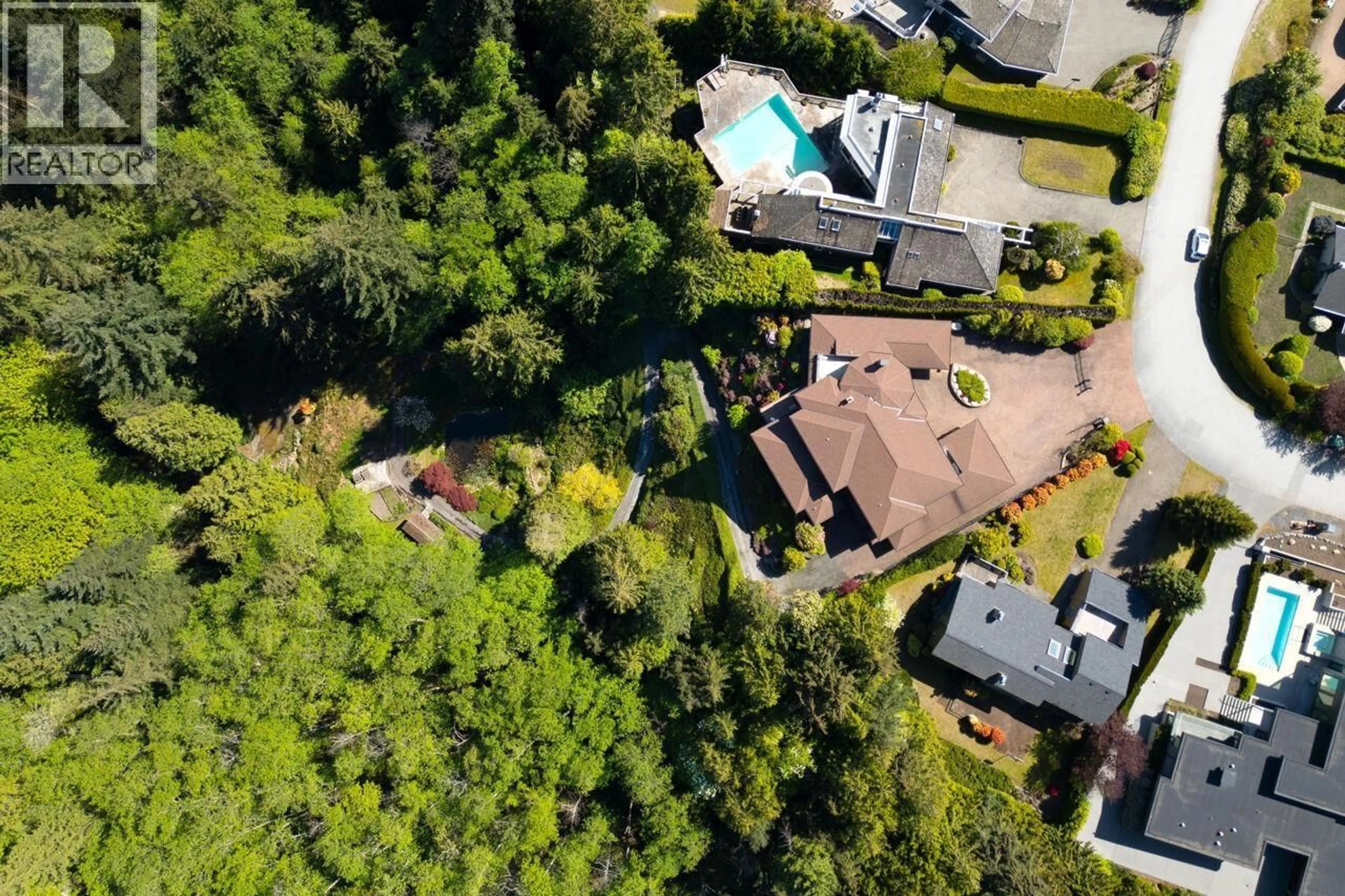 A pic from outside/outdoor area/front of a property/back of a property/a pic from drone, forest/trees view for 4228 ROCKRIDGE CRESCENT, West Vancouver British Columbia V7W1B1