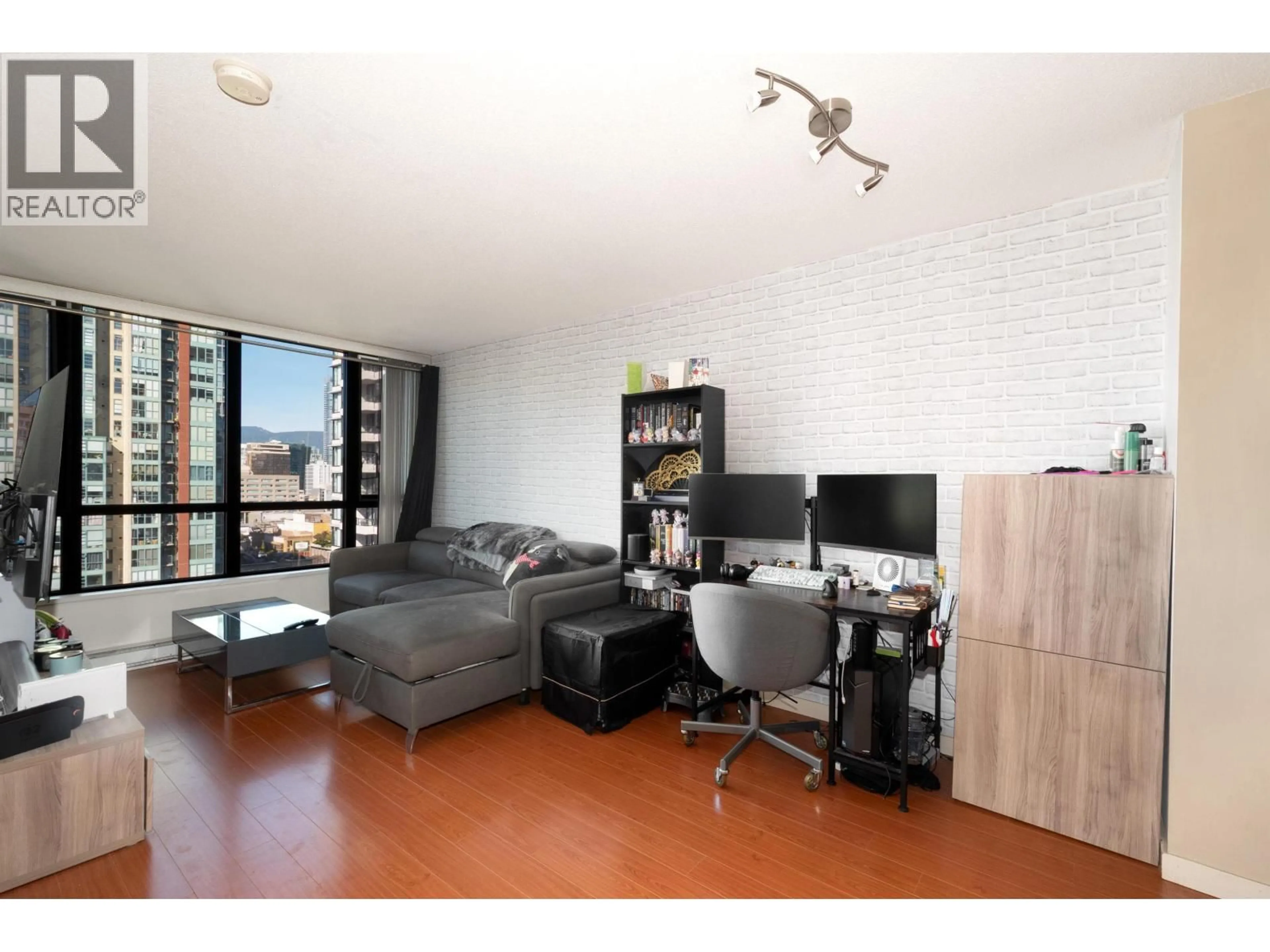Living room with furniture, wood/laminate floor for 2201 - 977 MAINLAND STREET, Vancouver British Columbia V6B1T2