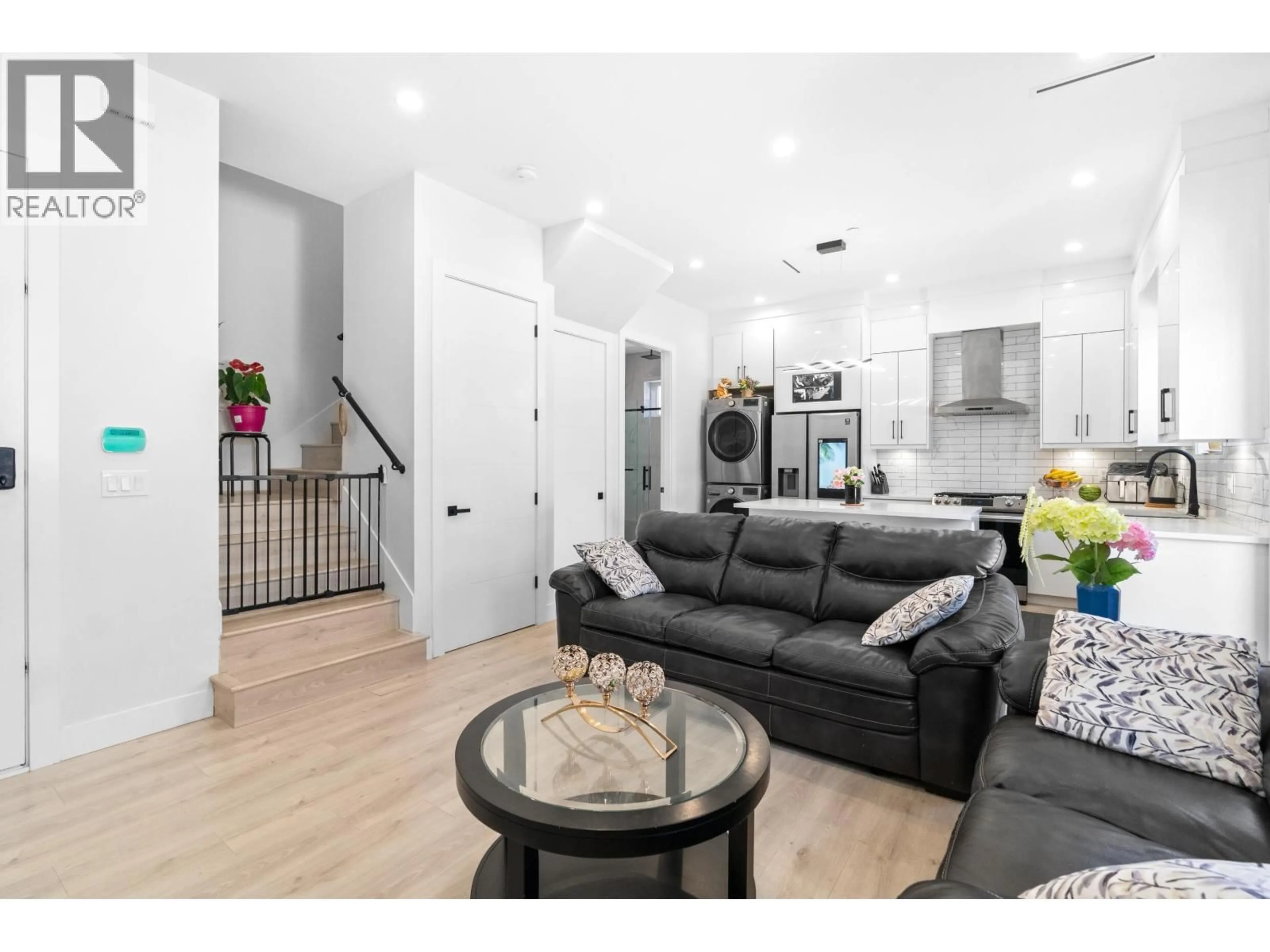 Living room with furniture, wood/laminate floor for 465 57TH AVENUE, Vancouver British Columbia V5X1S8