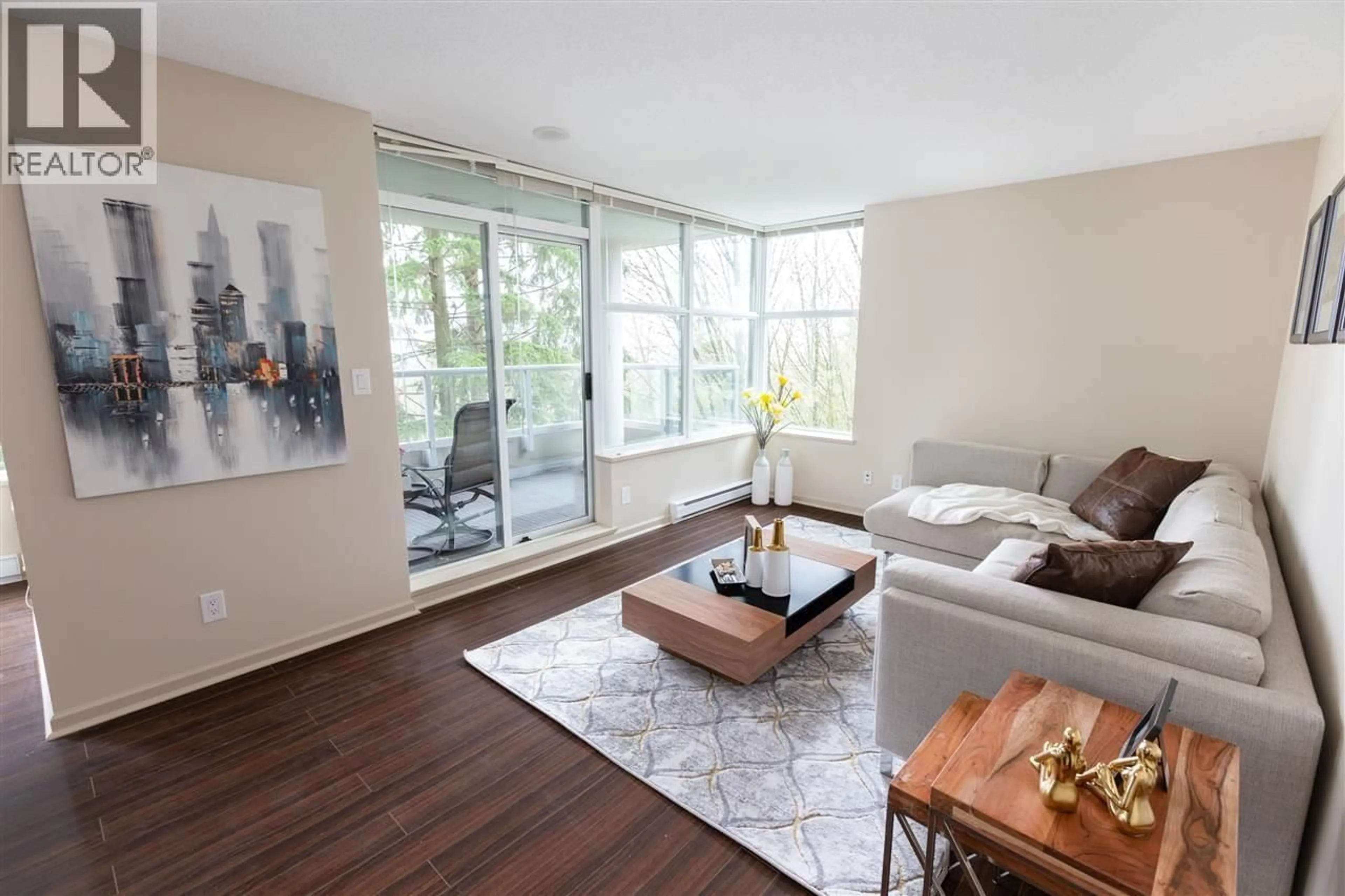 Living room with furniture, wood/laminate floor for 305 - 9232 UNIVERSITY CRESCENT, Burnaby British Columbia V5A0A3