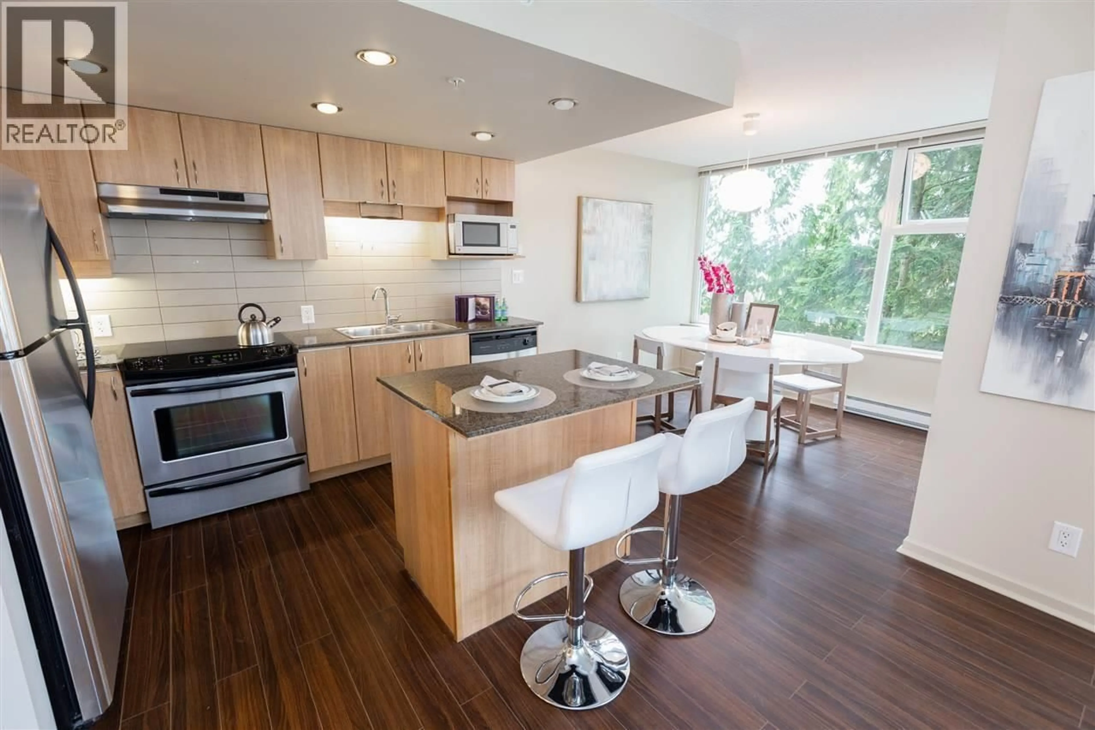 Open concept kitchen, wood/laminate floor for 305 - 9232 UNIVERSITY CRESCENT, Burnaby British Columbia V5A0A3