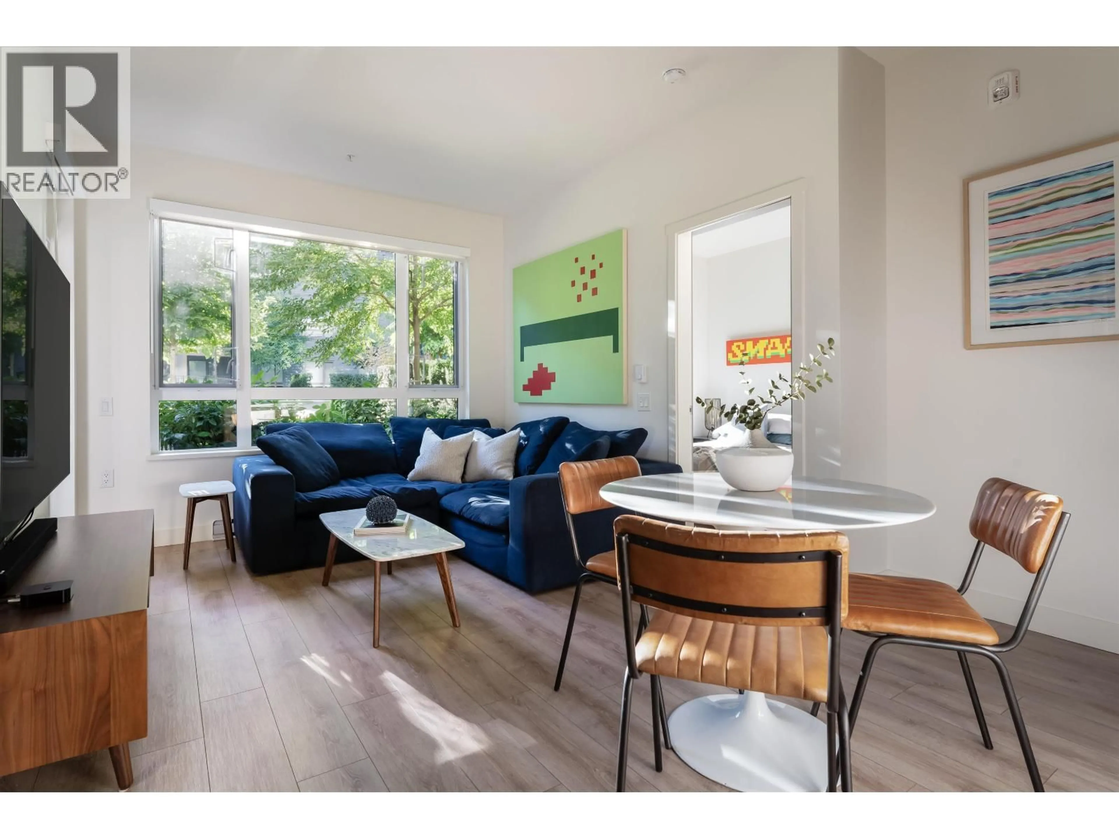 Living room with furniture, wood/laminate floor for 119 - 735 ANSKAR COURT, Coquitlam British Columbia V3J0L7