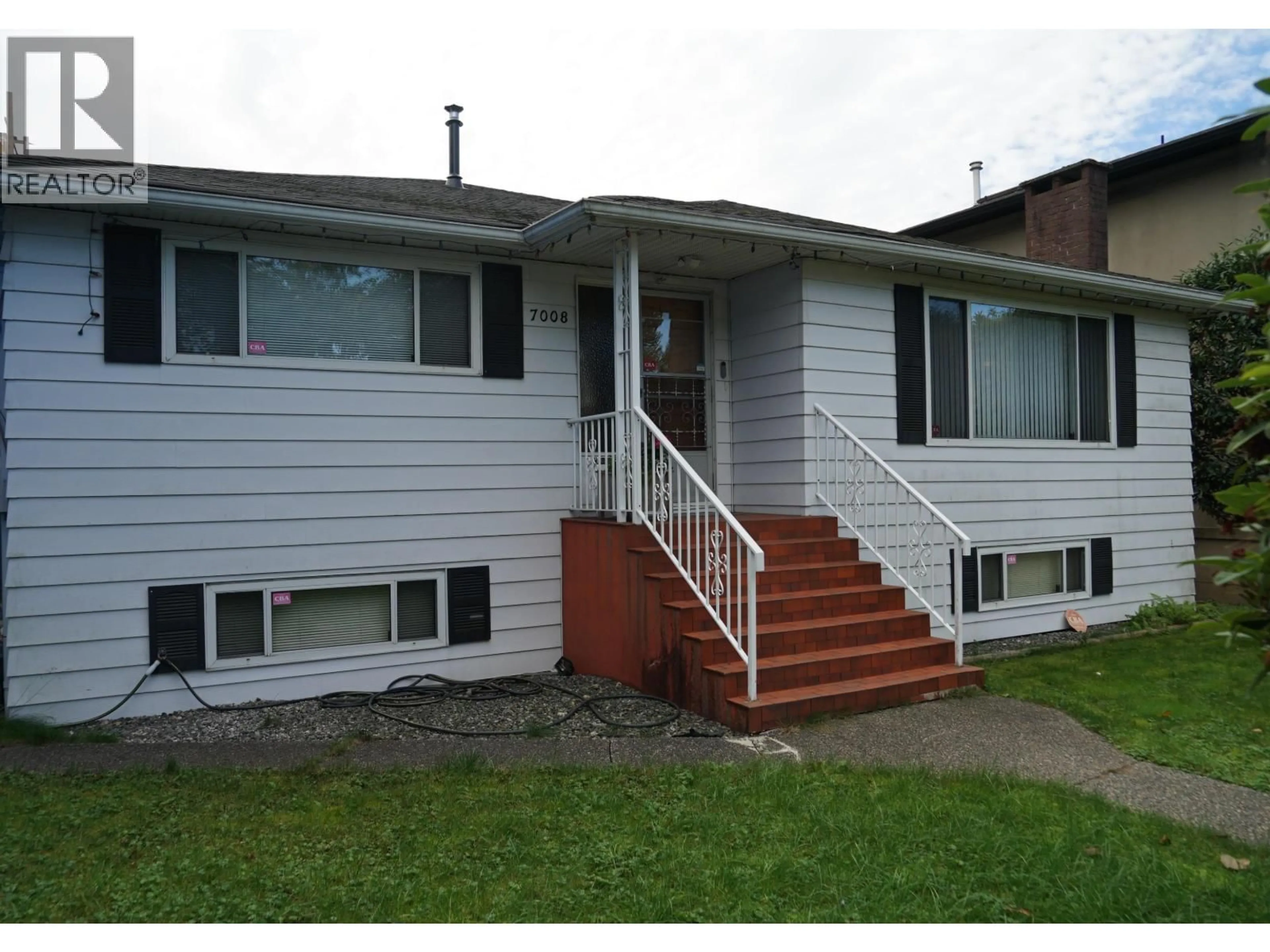 Home with vinyl exterior material, street for 7008 CURTIS STREET, Burnaby British Columbia V5A1J6