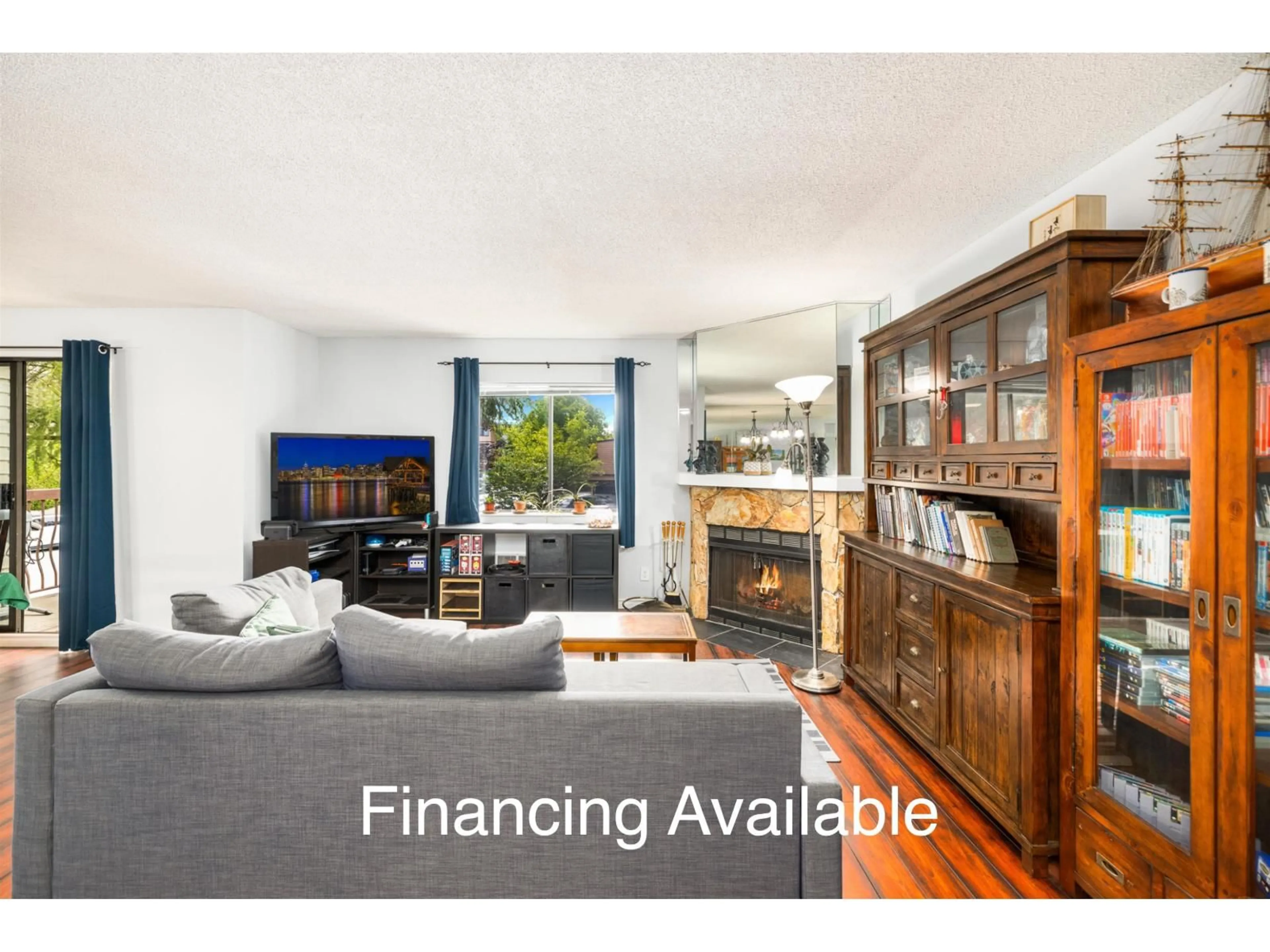 Living room with furniture, wood/laminate floor for 201 - 7064 133B, Surrey British Columbia V3W8A4