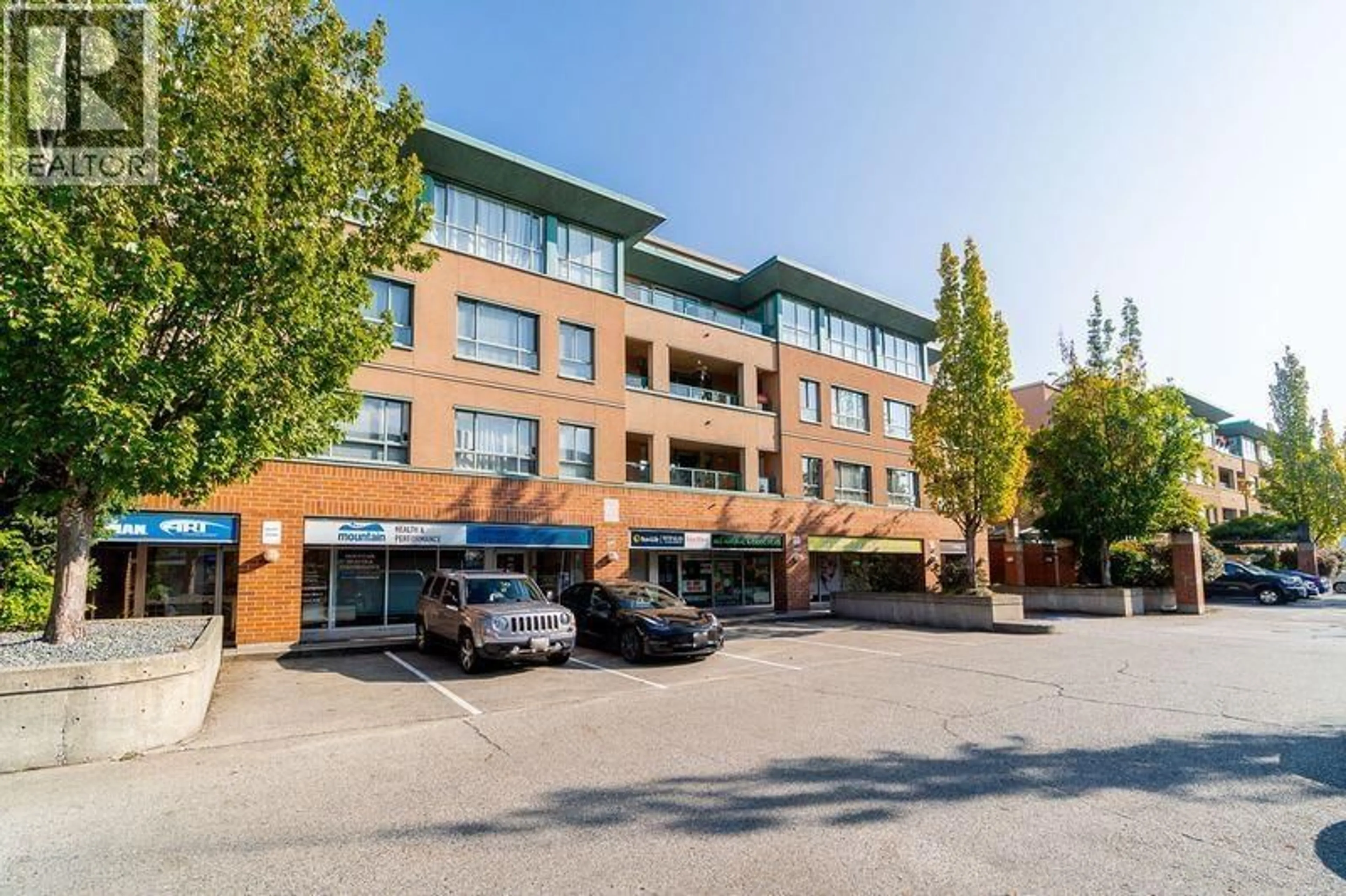 A pic from outside/outdoor area/front of a property/back of a property/a pic from drone, building for 211 - 223 MOUNTAIN HIGHWAY, North Vancouver British Columbia V7J3V3