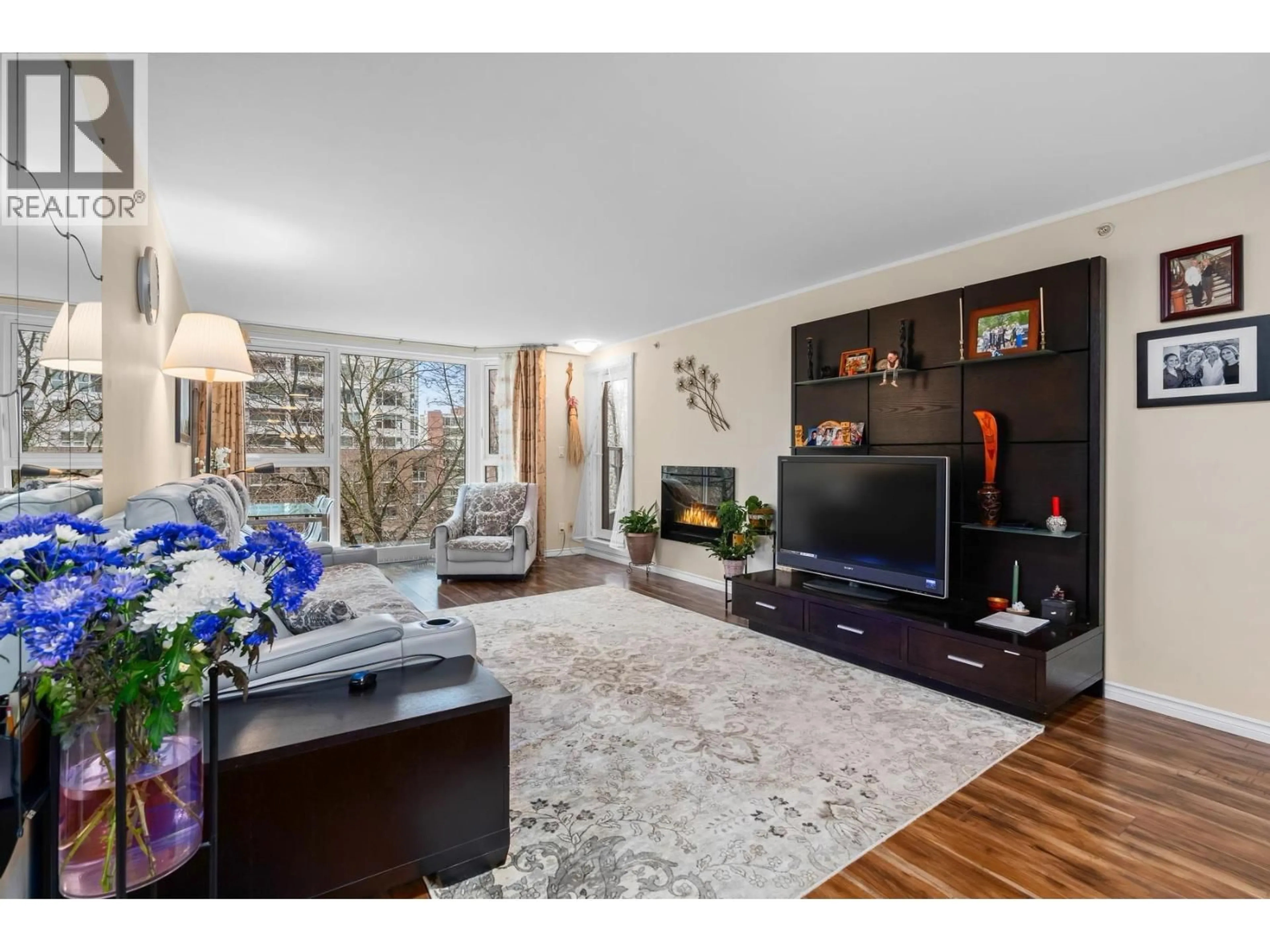 Living room with furniture, wood/laminate floor for 303 - 1488 HORNBY STREET, Vancouver British Columbia V6Z1X3