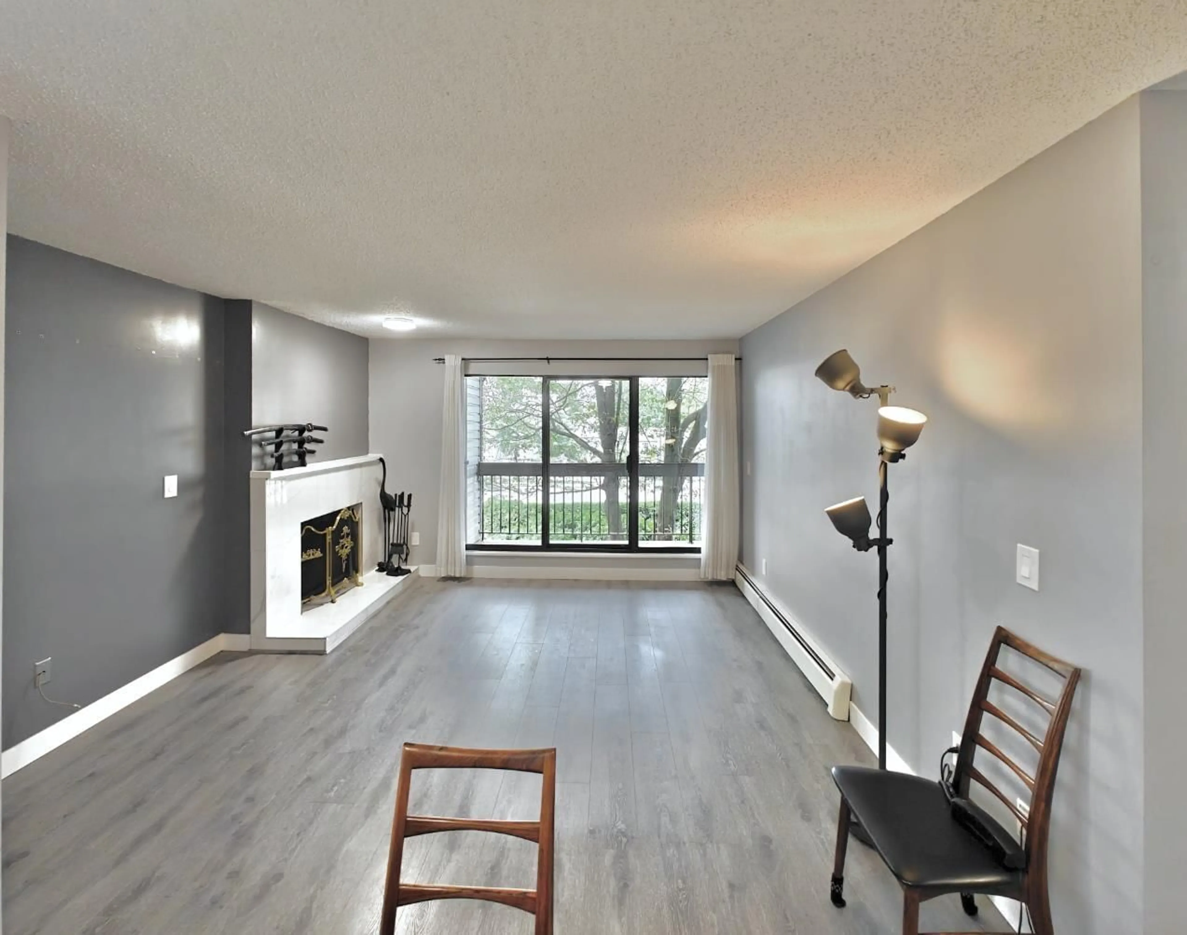 Living room with furniture, wood/laminate floor for 201 - 13316 OLD YALE, Surrey British Columbia V3T5J5