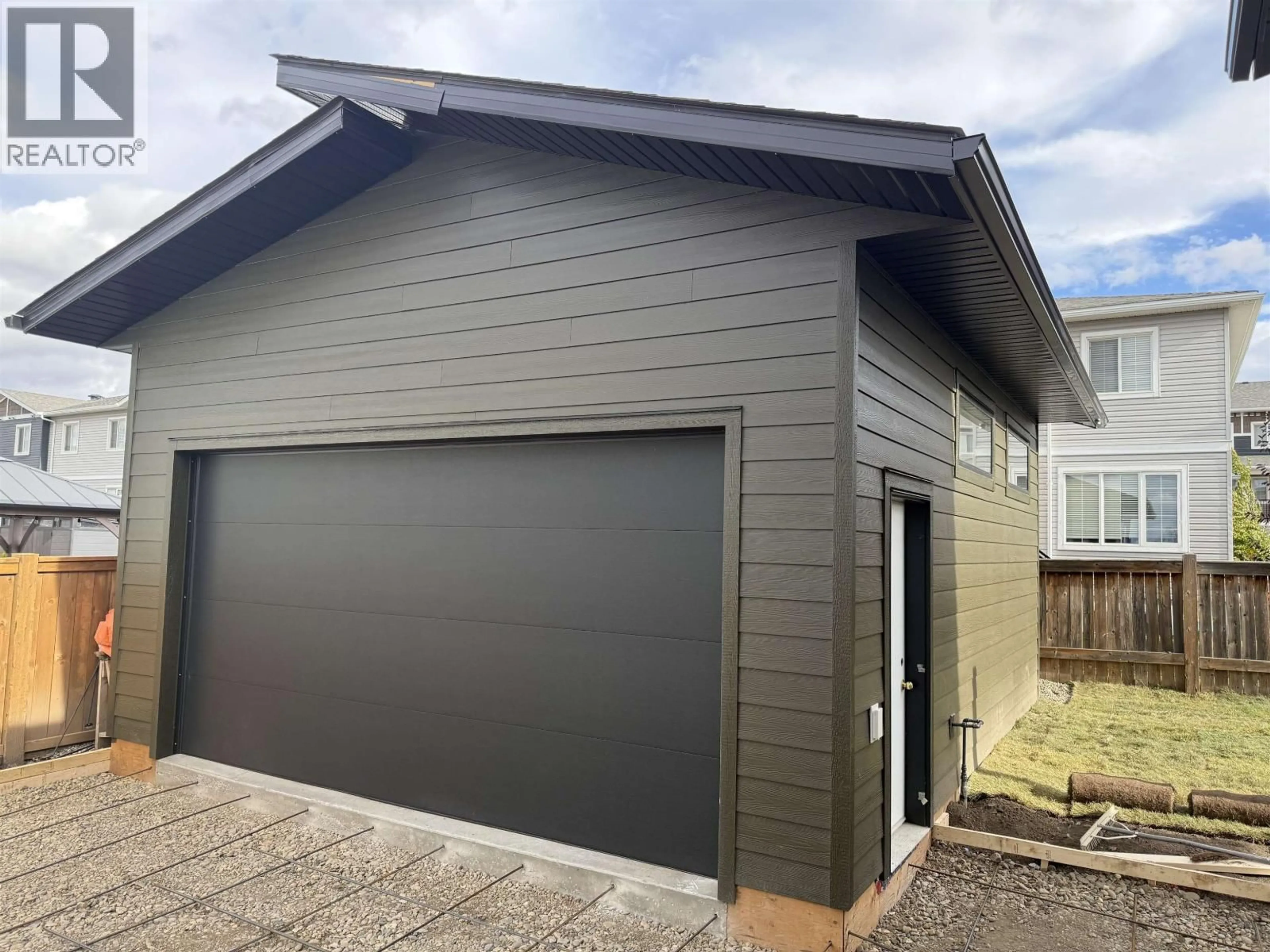 Home with vinyl exterior material, street for 11507 102A STREET, Fort St. John British Columbia V1J0P8