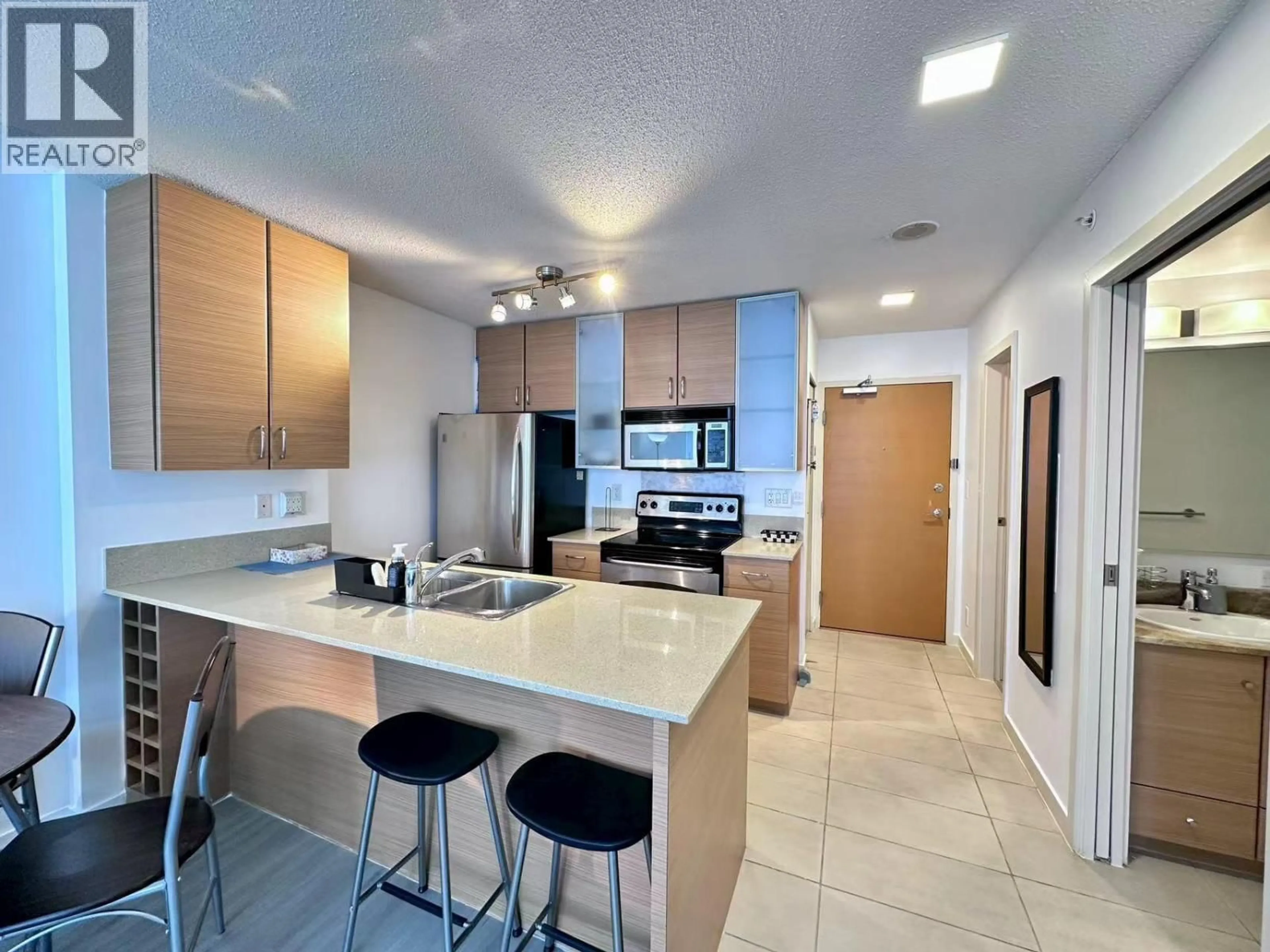 Open concept kitchen, ceramic/tile floor for 2404 - 977 MAINLAND STREET, Vancouver British Columbia V6B1T2
