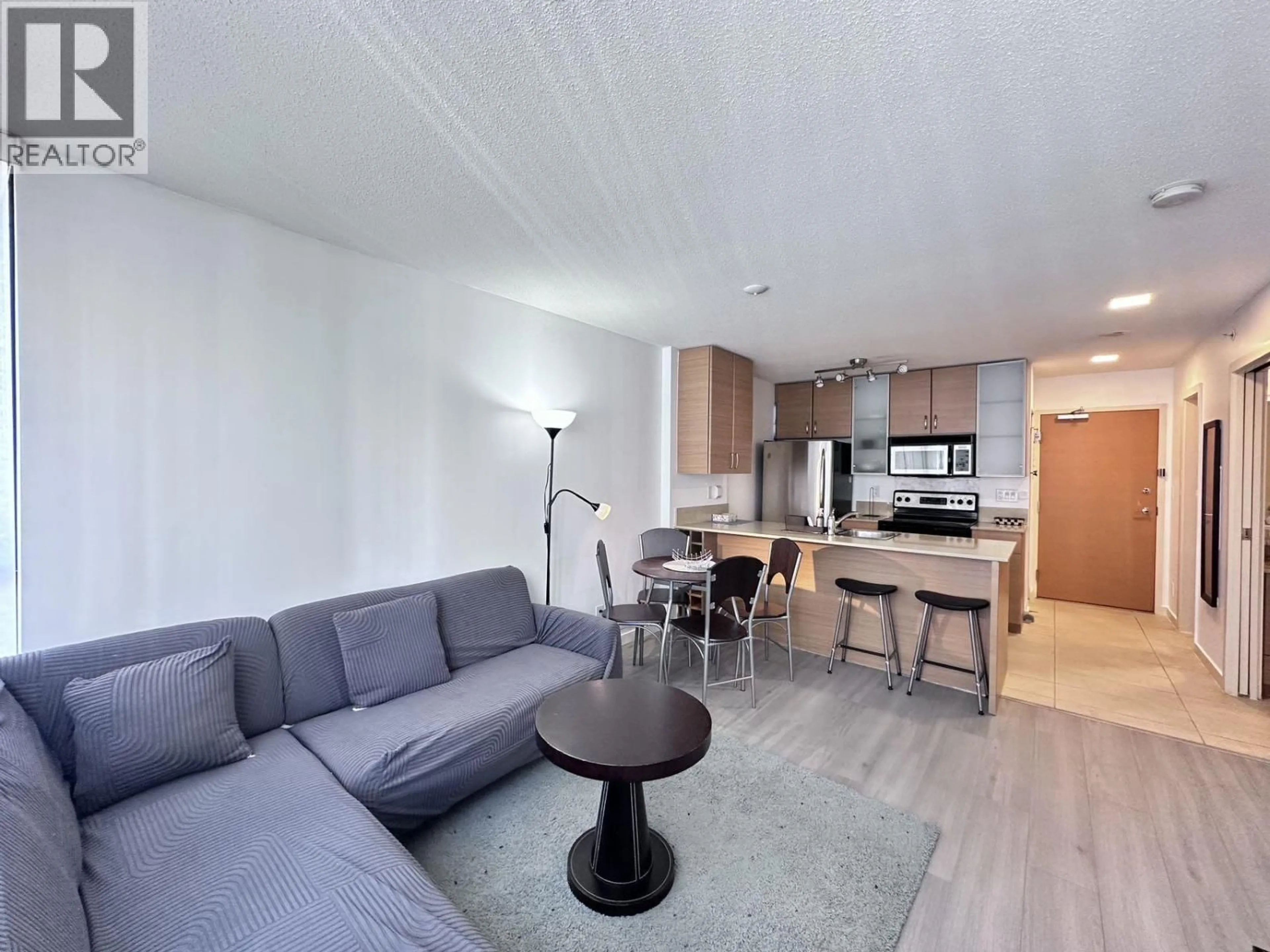 Living room with furniture, wood/laminate floor for 2404 - 977 MAINLAND STREET, Vancouver British Columbia V6B1T2