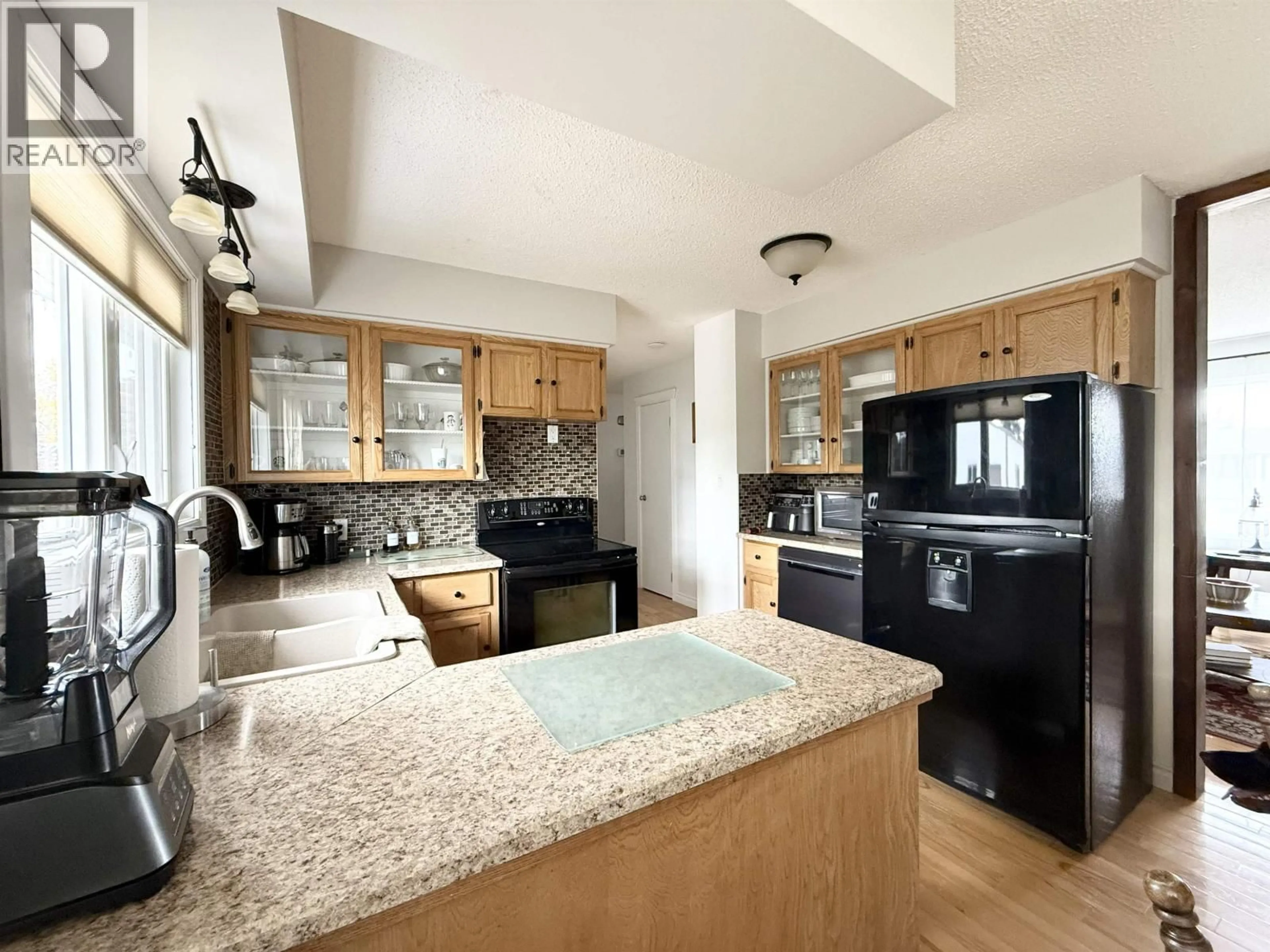 Open concept kitchen, ceramic/tile floor for 9803 113 AVENUE, Fort St. John British Columbia V1J4P7